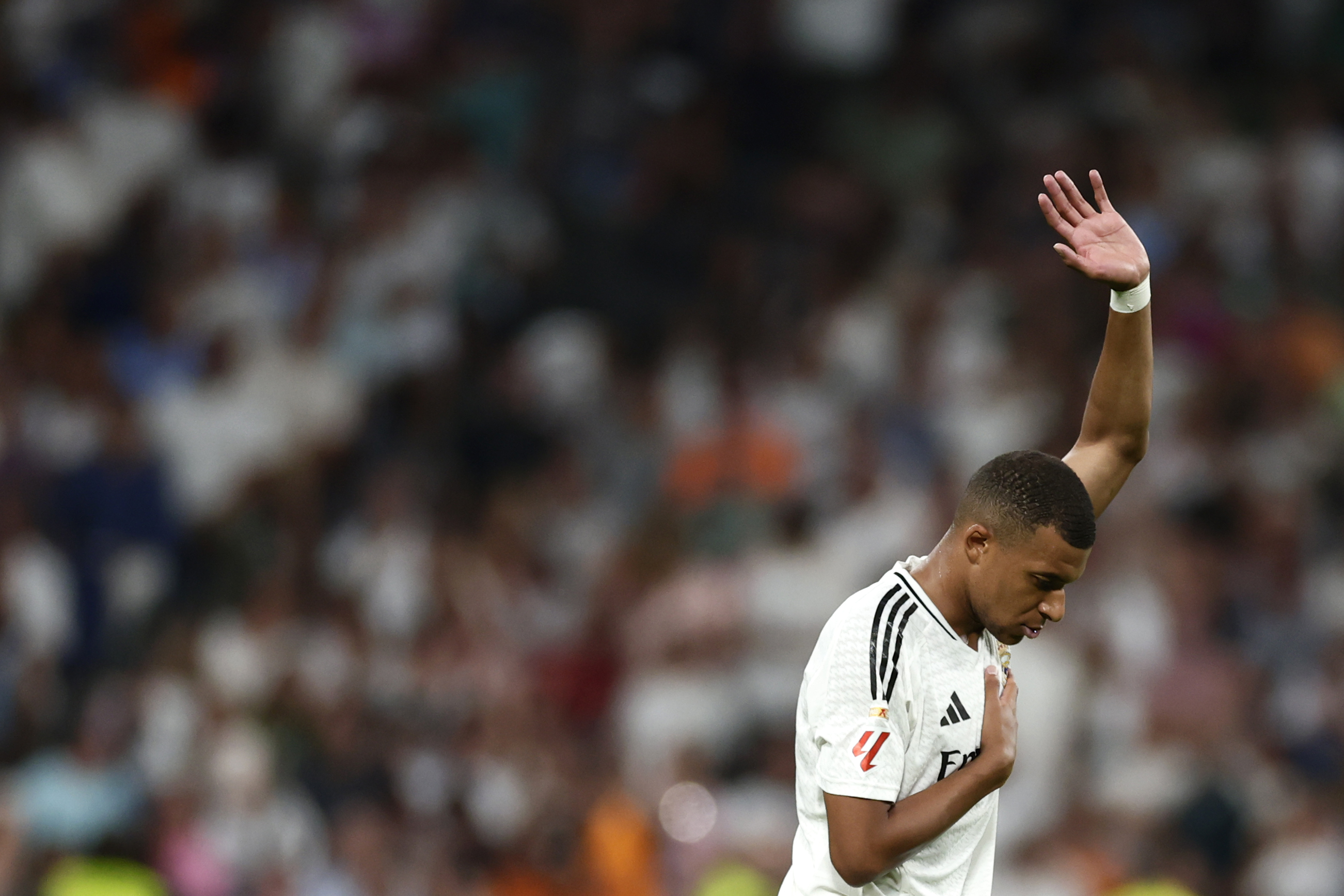 Real Madrid's Kylian Mbappe reacts after scoring his sides second goal during the Spanish La Liga soccer match between Real Madrid and Betis at the Santiago Bernabeu stadium in Madrid, Spain, Sunday, Sept. 1, 2024.