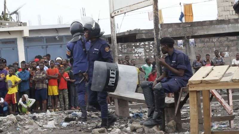 This image made from video shows police officers outside Makala prison in Kinshasa, Democratic Republic of the Congo, following an attempted jailbreak in Congo's main prison Monday.