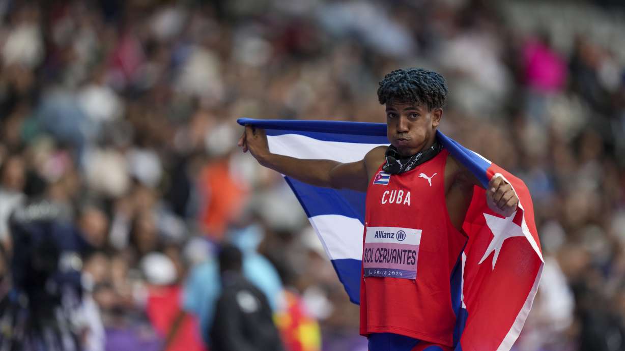 Cuba's Robiel Yankiel Sol Cervantes celebrates after winning the men's long jump T47 during the 2024 Paralympics, Tuesday, Sept. 3, 2024, in Paris, France.