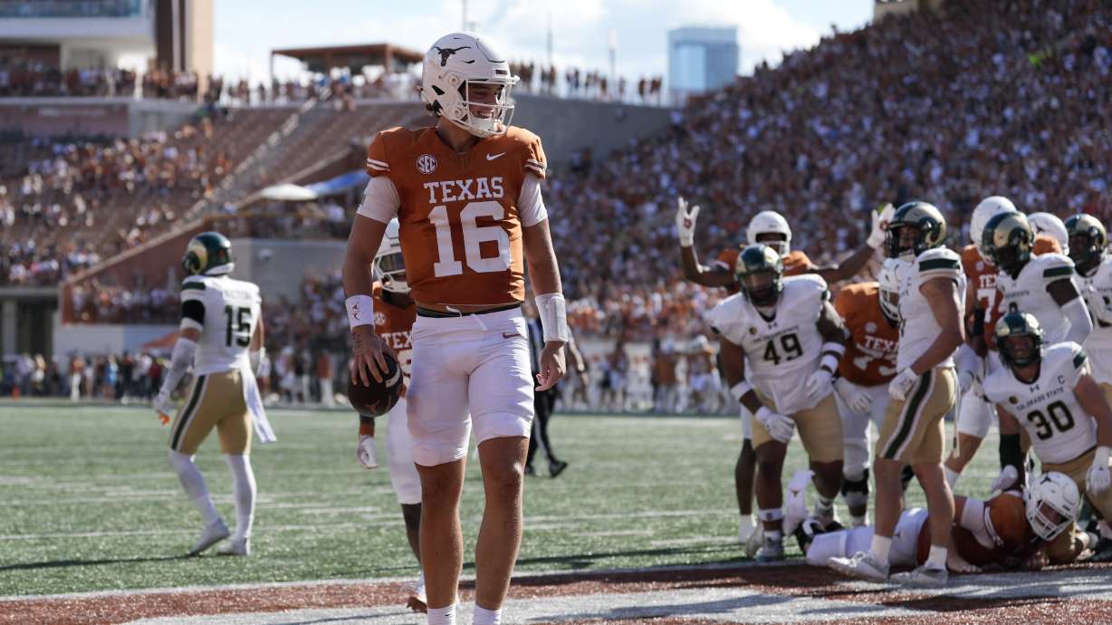 Texas quarterback Arch Manning (16) celebrates after scoring a touchdown against Colorado State during the second half of an NCAA college football game in Austin, Texas, Saturday, Aug. 31, 2024.