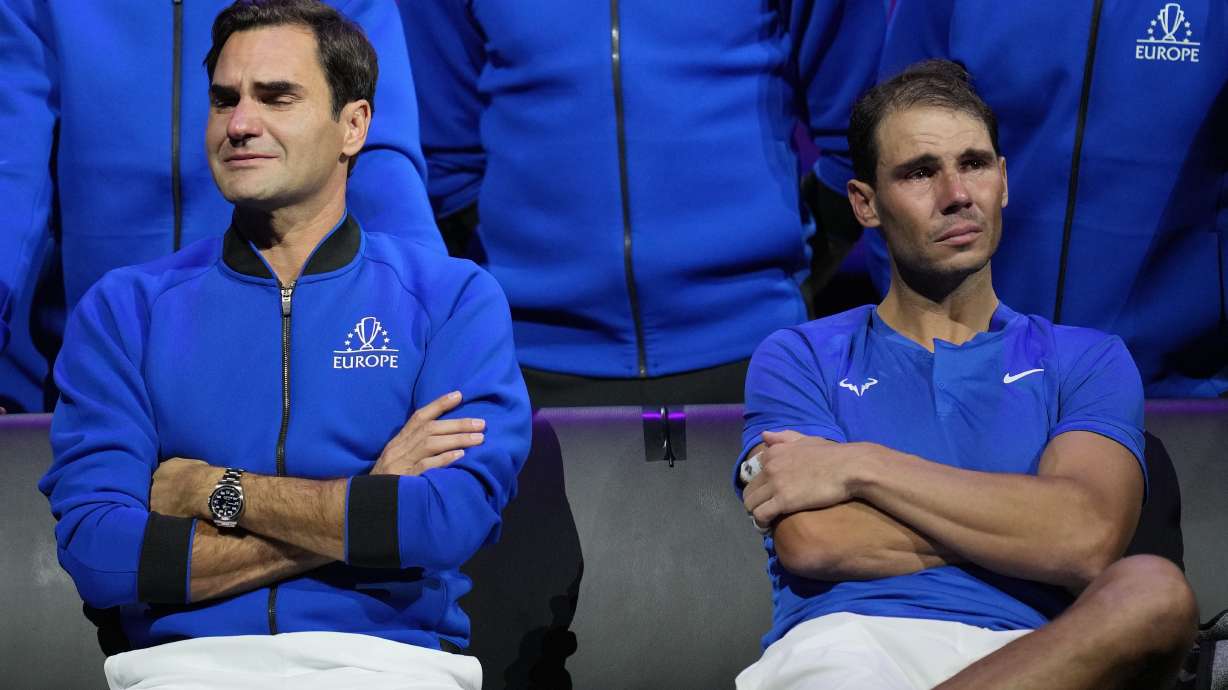 FILE - An emotional Roger Federer, left, of Team Europe, sits alongside his playing partner, Rafael Nadal, after their Laver Cup doubles match against Team World's Jack Sock and Frances Tiafoe at the O2 arena in London, Friday, Sept. 23, 2022.