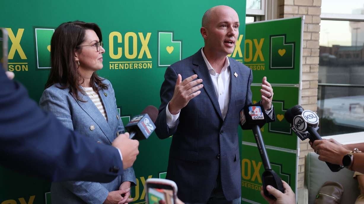 Gov. Spencer Cox and Lt. Gov. Deidre Henderson talk during a primary election night party in Salt Lake City on June 25. Utah Auditor John Dougall said it's "statistically likely" Cox's campaign gathered enough signatures to qualify for the primary ballot.