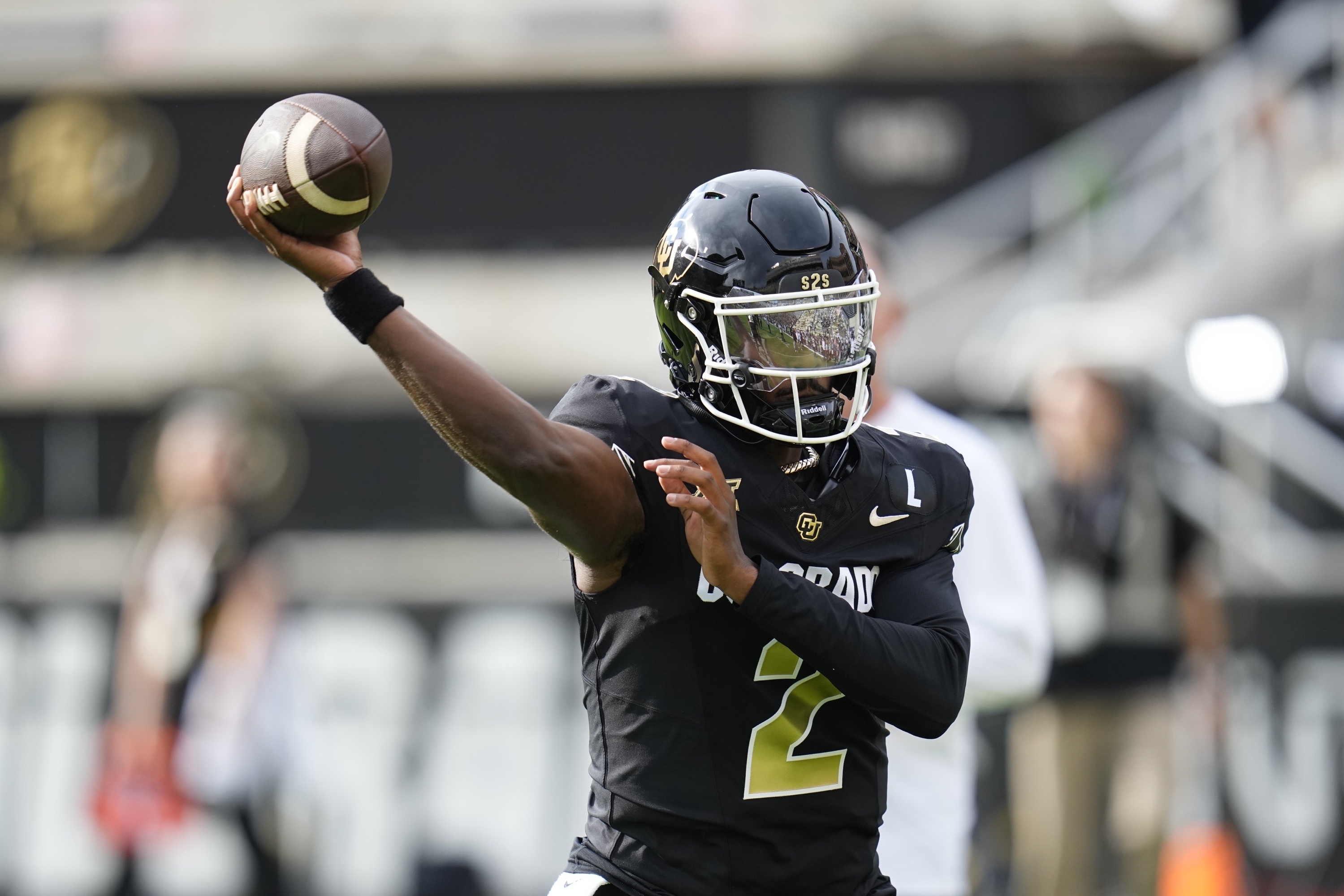 Colorado quarterback Shedeur Sanders warms up before an NCAA college football game against North Dakota State, Thursday, Aug. 29, 2024, in Boulder, Colo. 