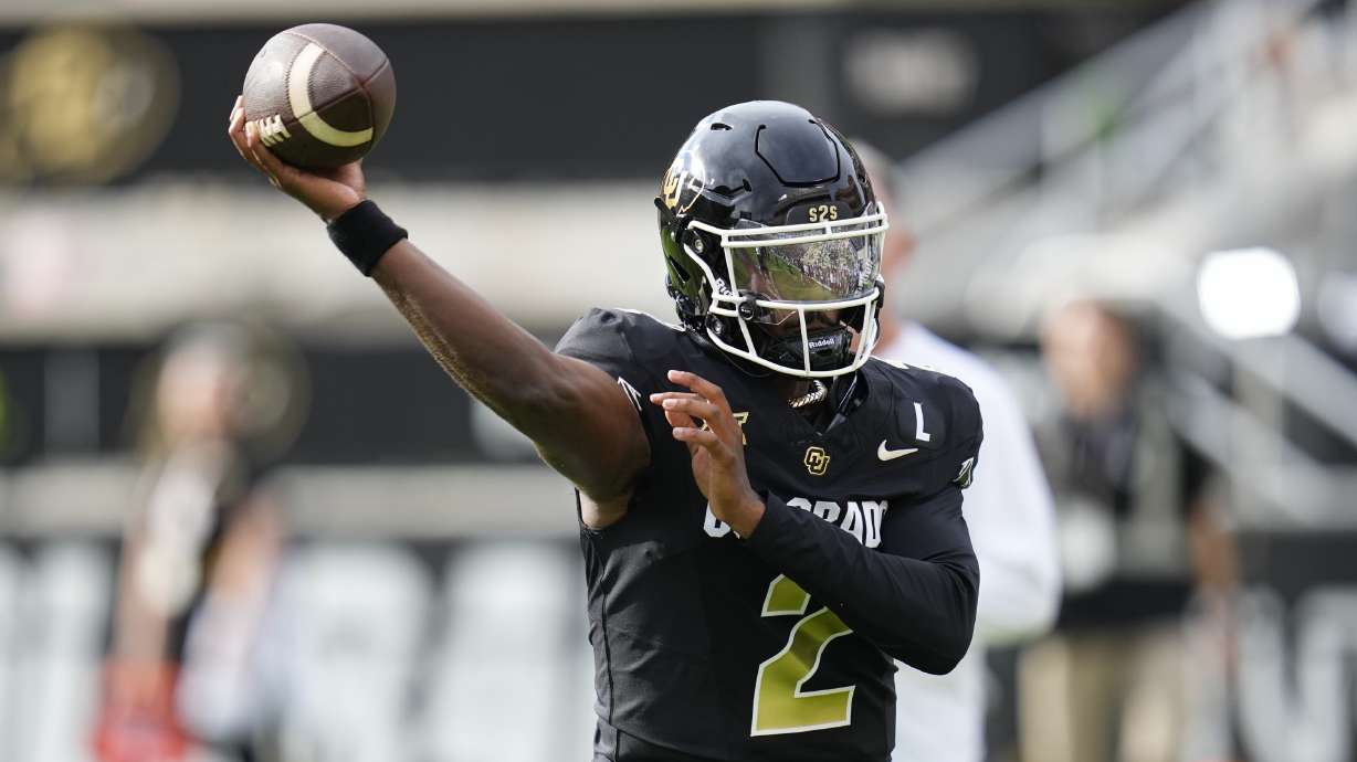 Colorado quarterback Shedeur Sanders warms up before an NCAA college football game against North Dakota State, Thursday, Aug. 29, 2024, in Boulder, Colo.