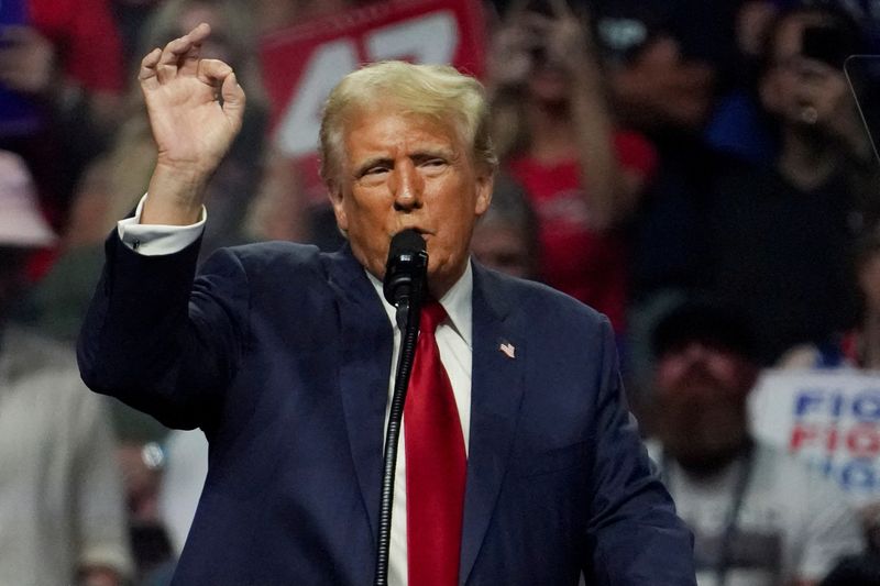 Republican presidential nominee and former president Donald Trump speaks at a rally in Glendale, Ariz., Aug. 23. Trump said in a court filing on Tuesday that he would plead not guilty to criminal charges in a revised indictment accusing him of attempting to overturn his 2020 election defeat.