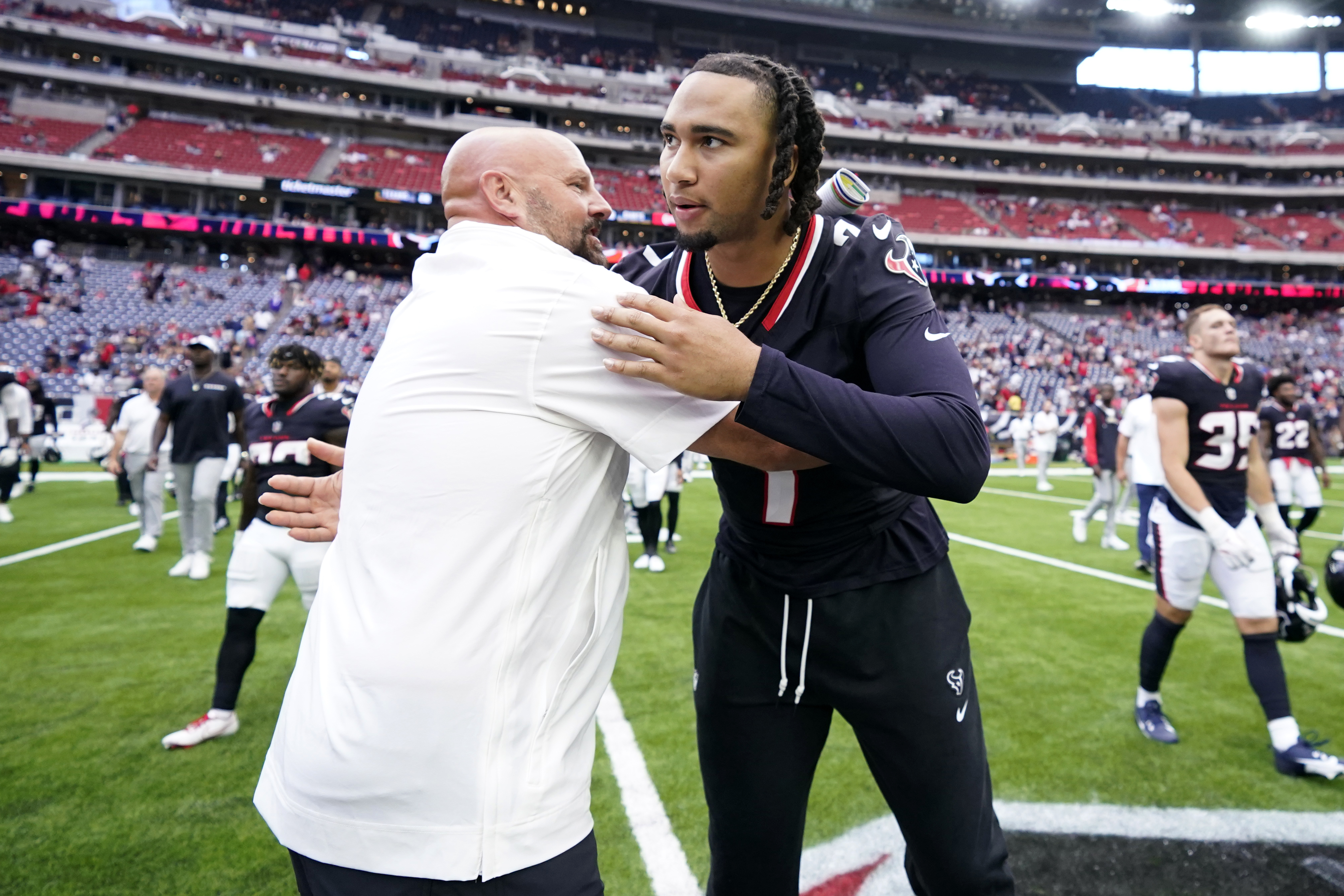 New York Giants head coach Brian Daboll, left, and Houston Texans quarterback C.J. Stroud, greet each other after a preseason NFL football game, Saturday, Aug. 17, 2024, in Houston. 