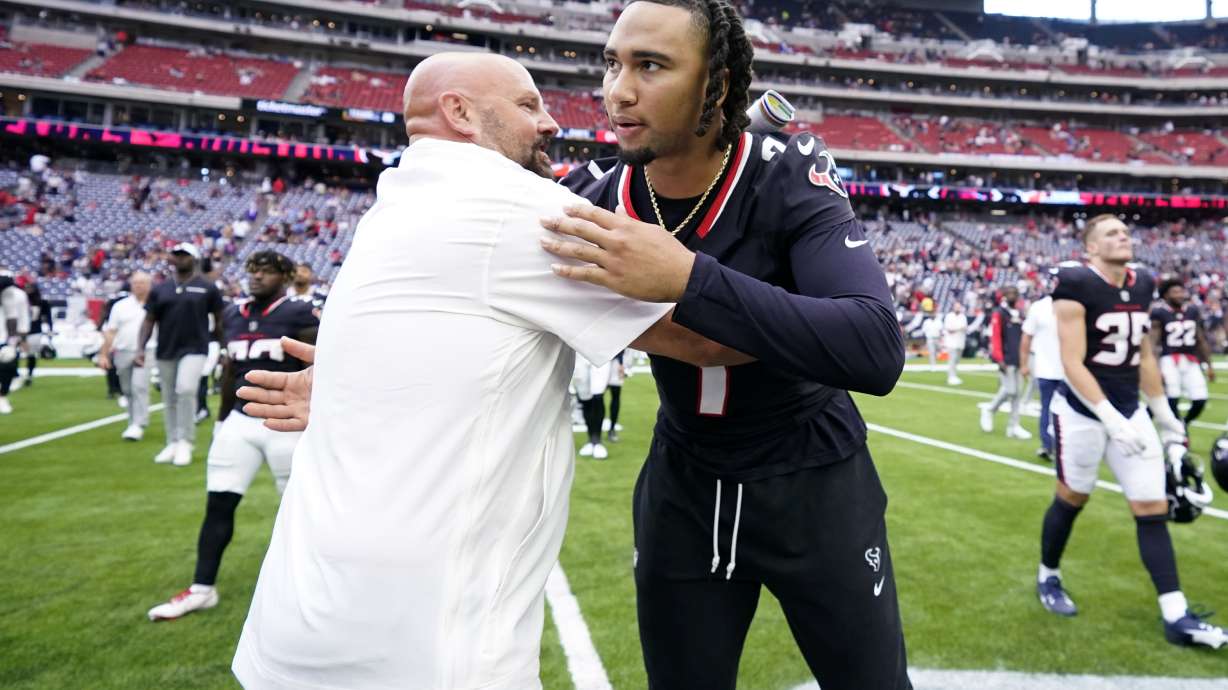 New York Giants head coach Brian Daboll, left, and Houston Texans quarterback C.J. Stroud, greet each other after a preseason NFL football game, Saturday, Aug. 17, 2024, in Houston.