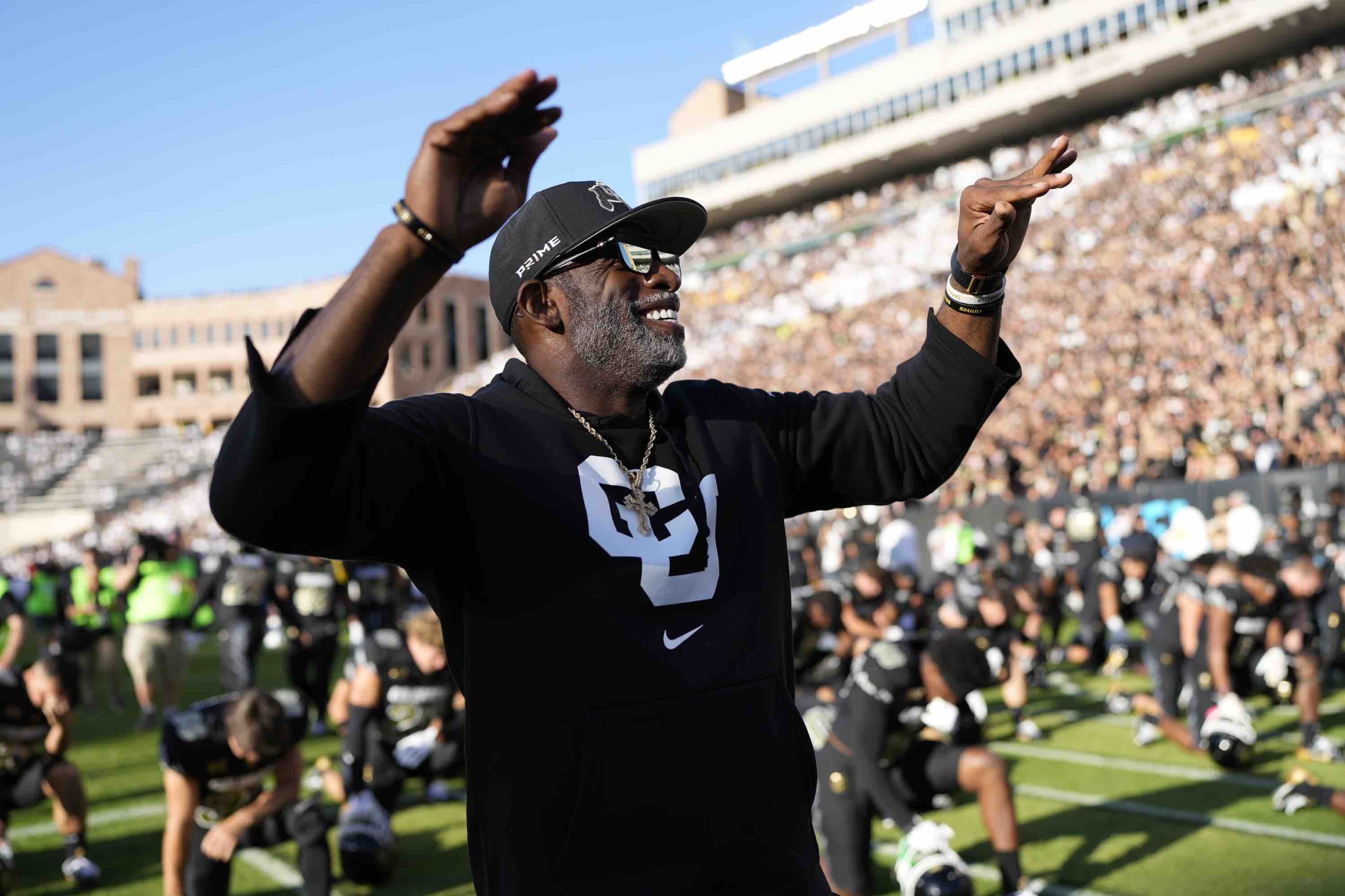 Colorado head coach Deion Sanders conducts fans before an NCAA college football game against North Dakota State, Thursday, Aug. 29, 2024, in Boulder, Colo.