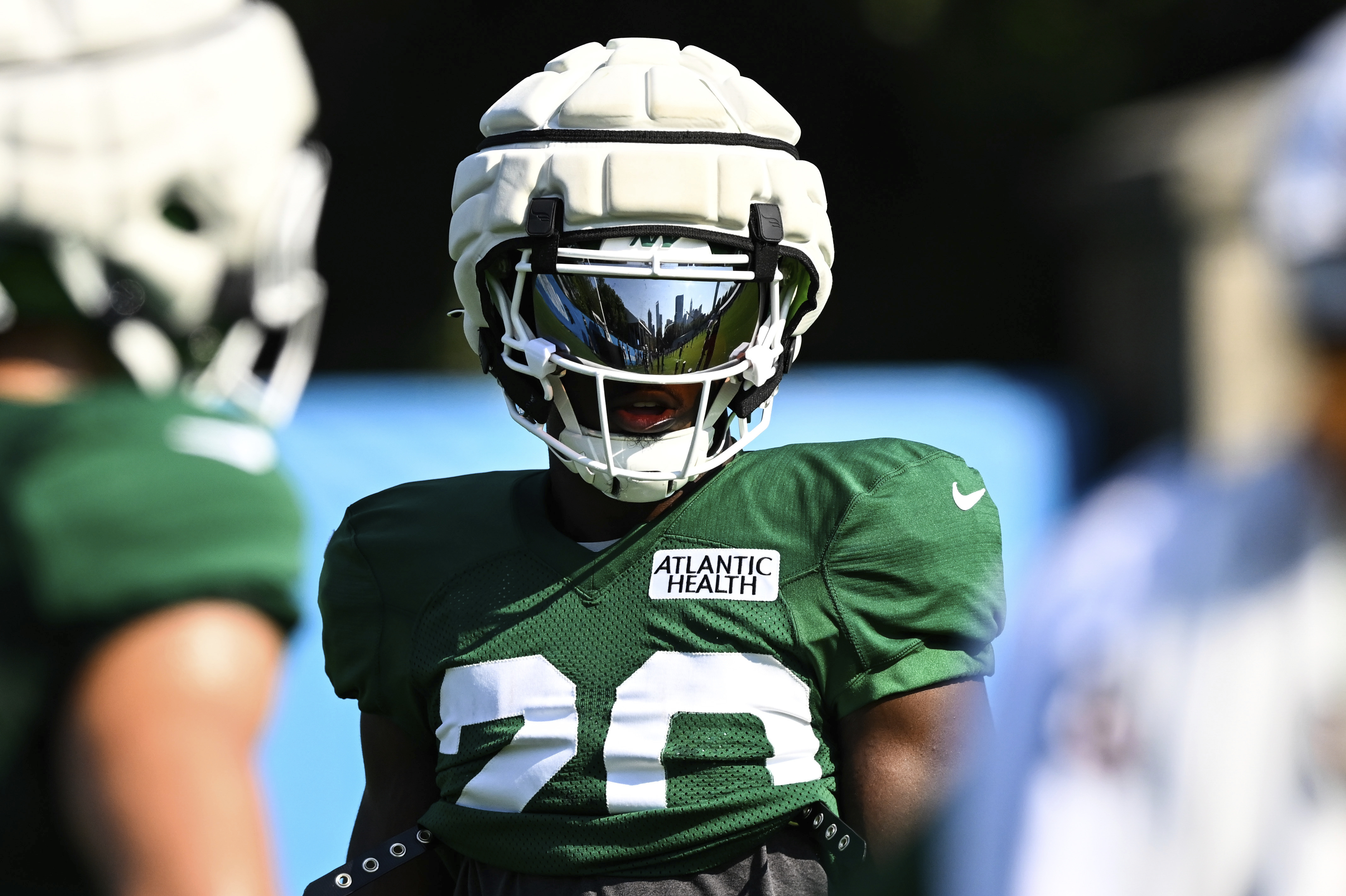 New York Jets running back Breece Hall (20) looks on during an NFL football joint practice with the Carolina Panthers Thursday, Aug. 15, 2024, in Charlotte, N.C.