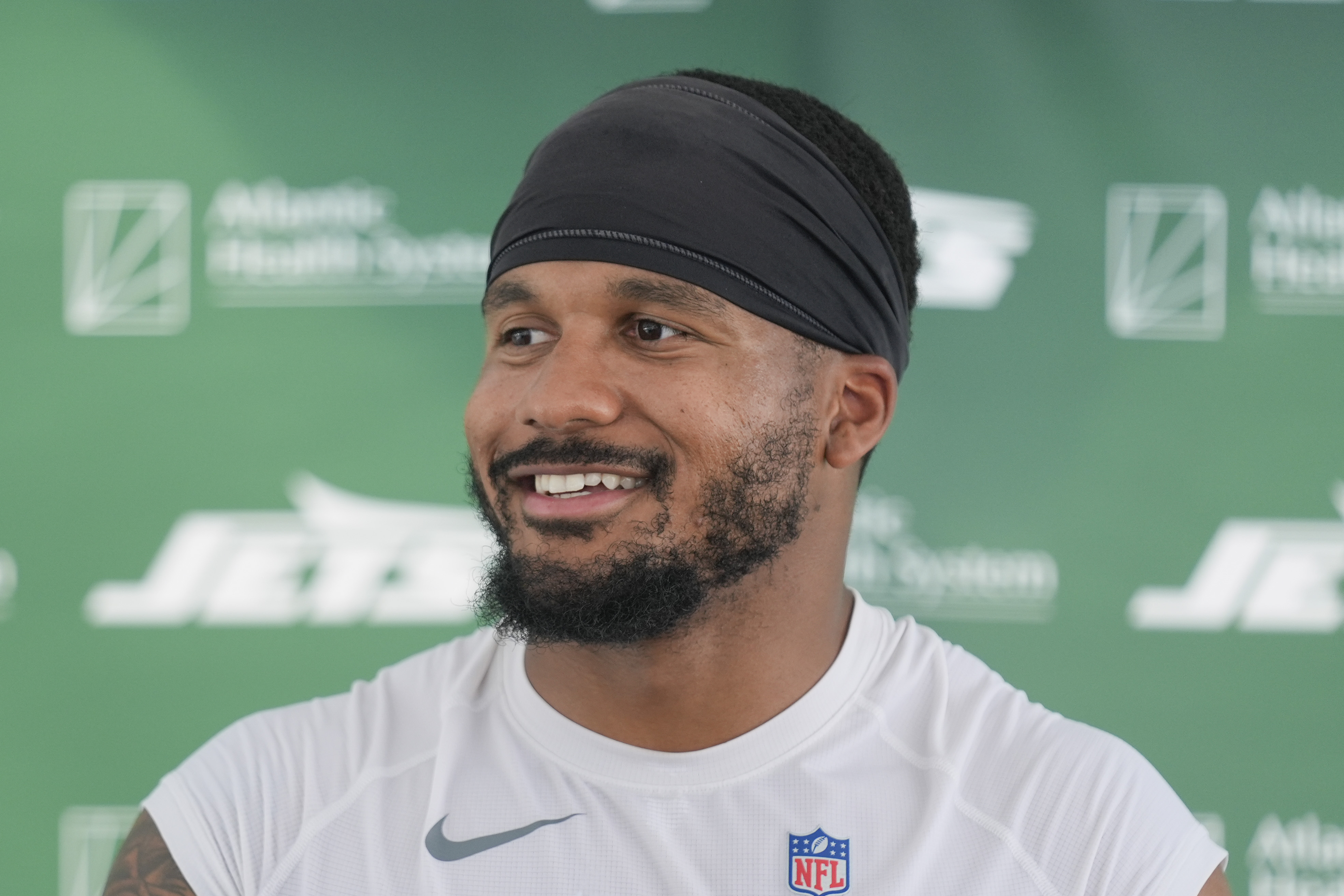 FILE - New York Jets' Michael Carter II speaks to reporters after a practice at the NFL football team's training facility in Florham Park, N.J., July 30, 2024. 