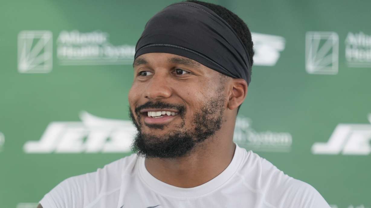 FILE - New York Jets' Michael Carter II speaks to reporters after a practice at the NFL football team's training facility in Florham Park, N.J., July 30, 2024.