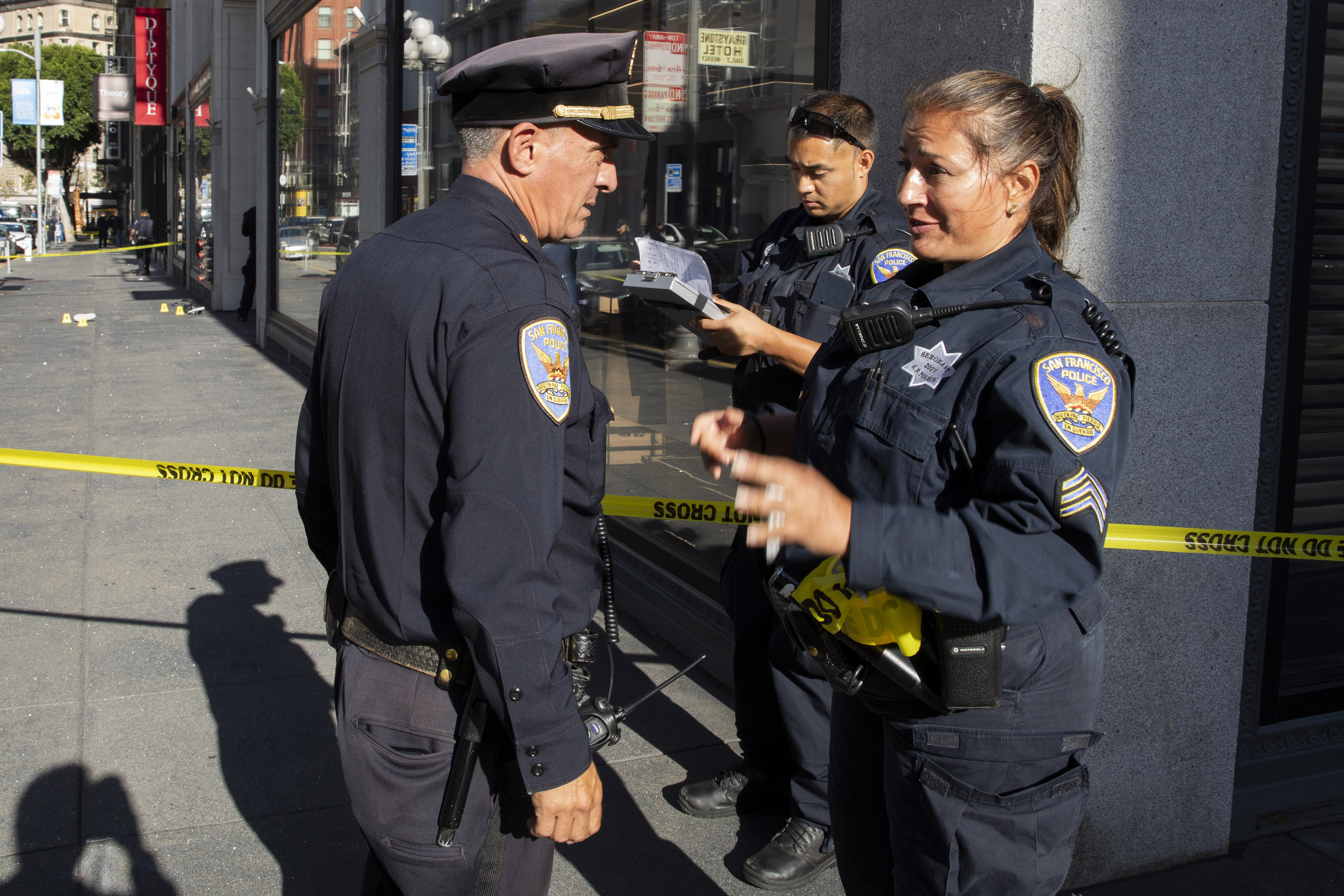 San Francisco Police Department Sgt. Joelle Harrell, right, at the scene of a shooting in Union Square, where San Francisco 49ers rookie wide receiver Ricky Pearsall was shot in the chest during an attempted robbery, Saturday, Aug. 31, 2024, in San Francisco. 