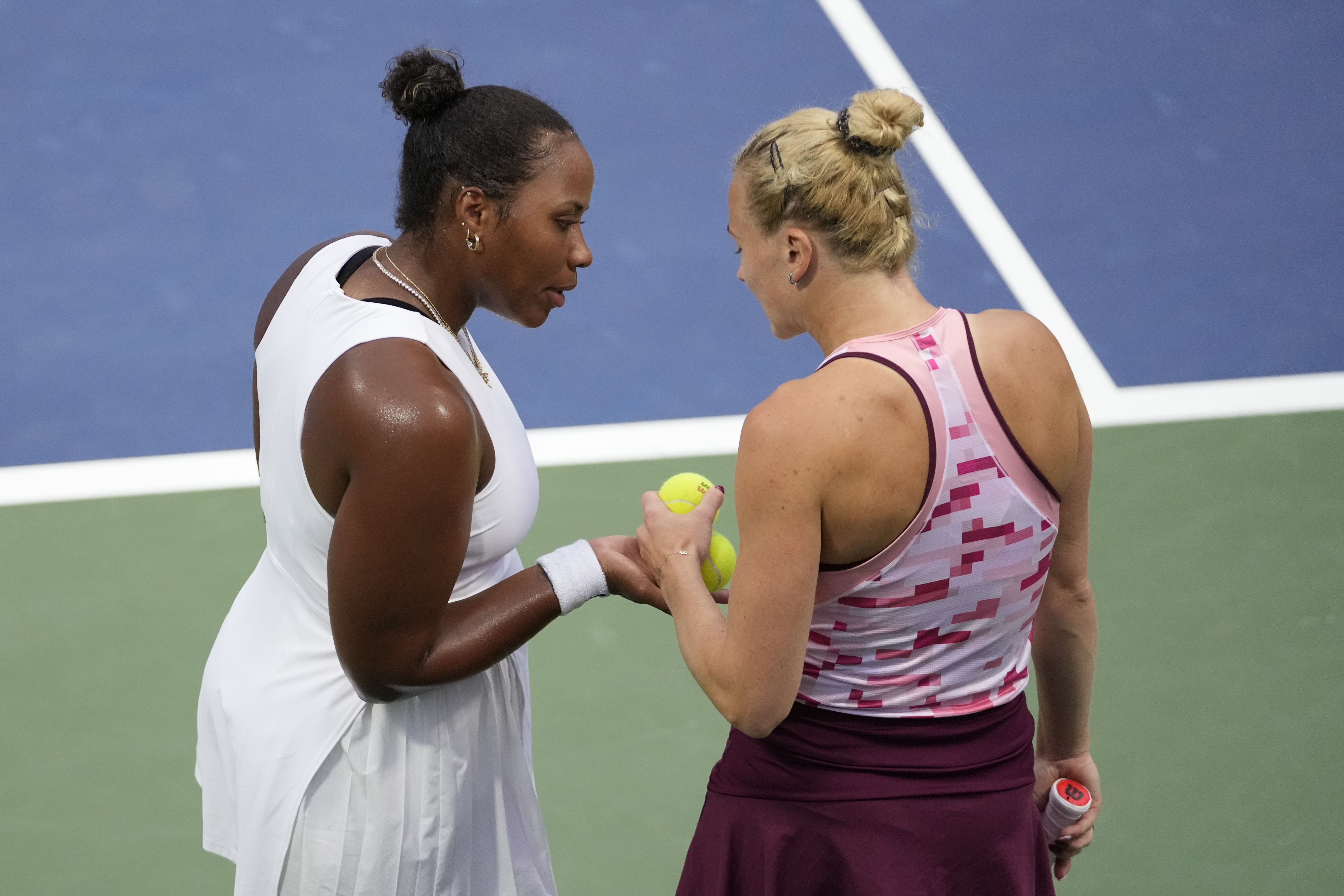 Katerina Siniakova, of the Czech Republic, and Taylor Townsend, of the United States, react during a second round match of the U.S. Open tennis championships, Thursday, Aug. 29, 2024, in New York. 