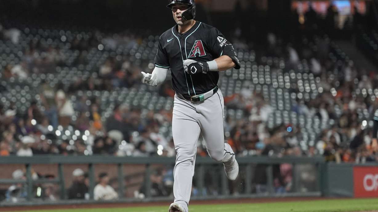 Arizona Diamondbacks' Randal Grichuk reacts after hitting a home run against the San Francisco Giants during the fifth inning of a baseball game in San Francisco, Tuesday, Sept. 3, 2024.