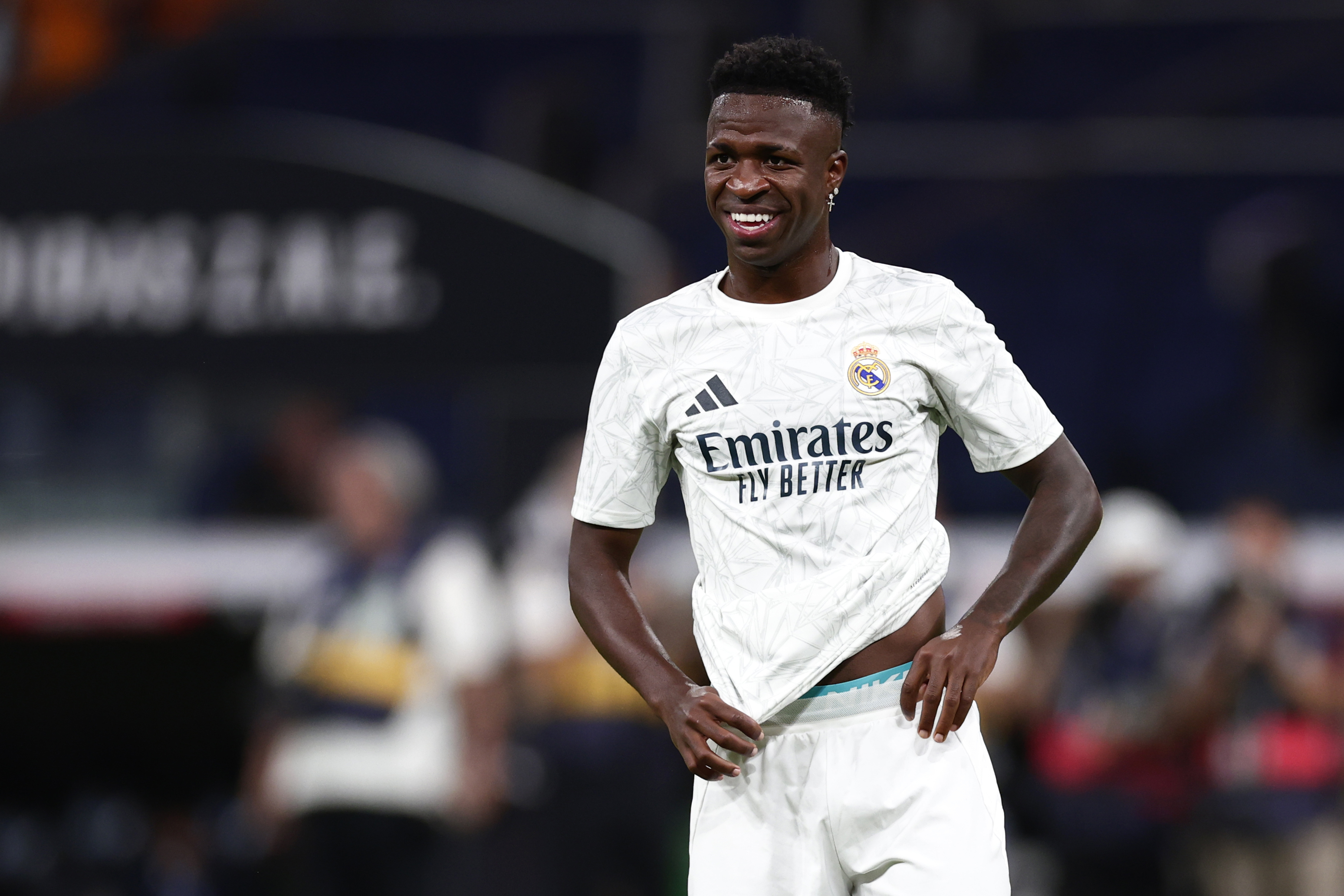 Real Madrid's Vinicius Junior smiles before the Spanish La Liga soccer match between Real Madrid and Betis at the Santiago Bernabeu stadium in Madrid, Spain, Sunday, Sept. 1, 2024. 