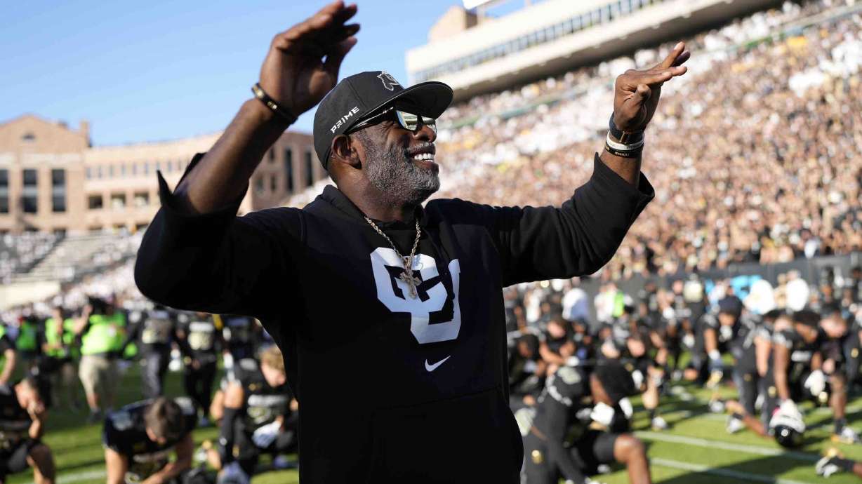 Colorado head coach Deion Sanders conducts fans before an NCAA college football game against North Dakota State, Thursday, Aug. 29, 2024, in Boulder, Colo.