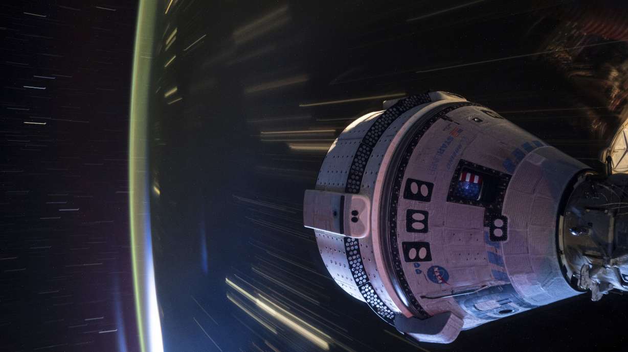 Boeing's Starliner spacecraft is shown being docked to the Harmony module of the International Space Station on July 3. Starliner will return to Earth without a crew on Friday.