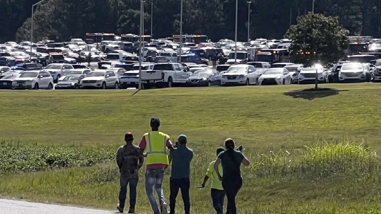 Law enforcement officers in Georgia responded on Wednesday to a shooting that killed two fellow students and two teachers, while wounding nine others, authorities said.
