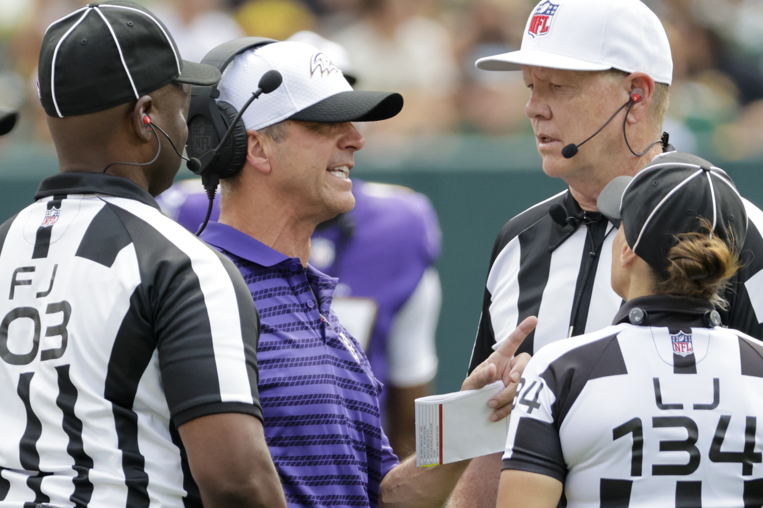 Baltimore Ravens head coach John Harbaugh argues a call during the second half of a preseason NFL football game against the Green Bay Packers Saturday, Aug. 24, 2024, in Green Bay, Wis. 