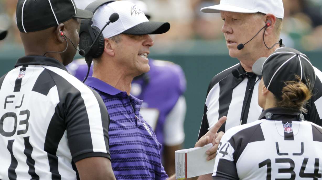 Baltimore Ravens head coach John Harbaugh argues a call during the second half of a preseason NFL football game against the Green Bay Packers Saturday, Aug. 24, 2024, in Green Bay, Wis.