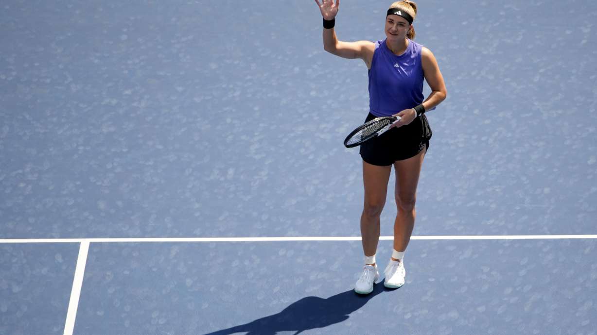 Karolina Muchova, of the Czech Republic, waves to the crowd after defeating Beatriz Haddad Maia, of Brazil, during the quarterfinals of the U.S. Open tennis championships, Wednesday, Sept. 4, 2024, in New York.