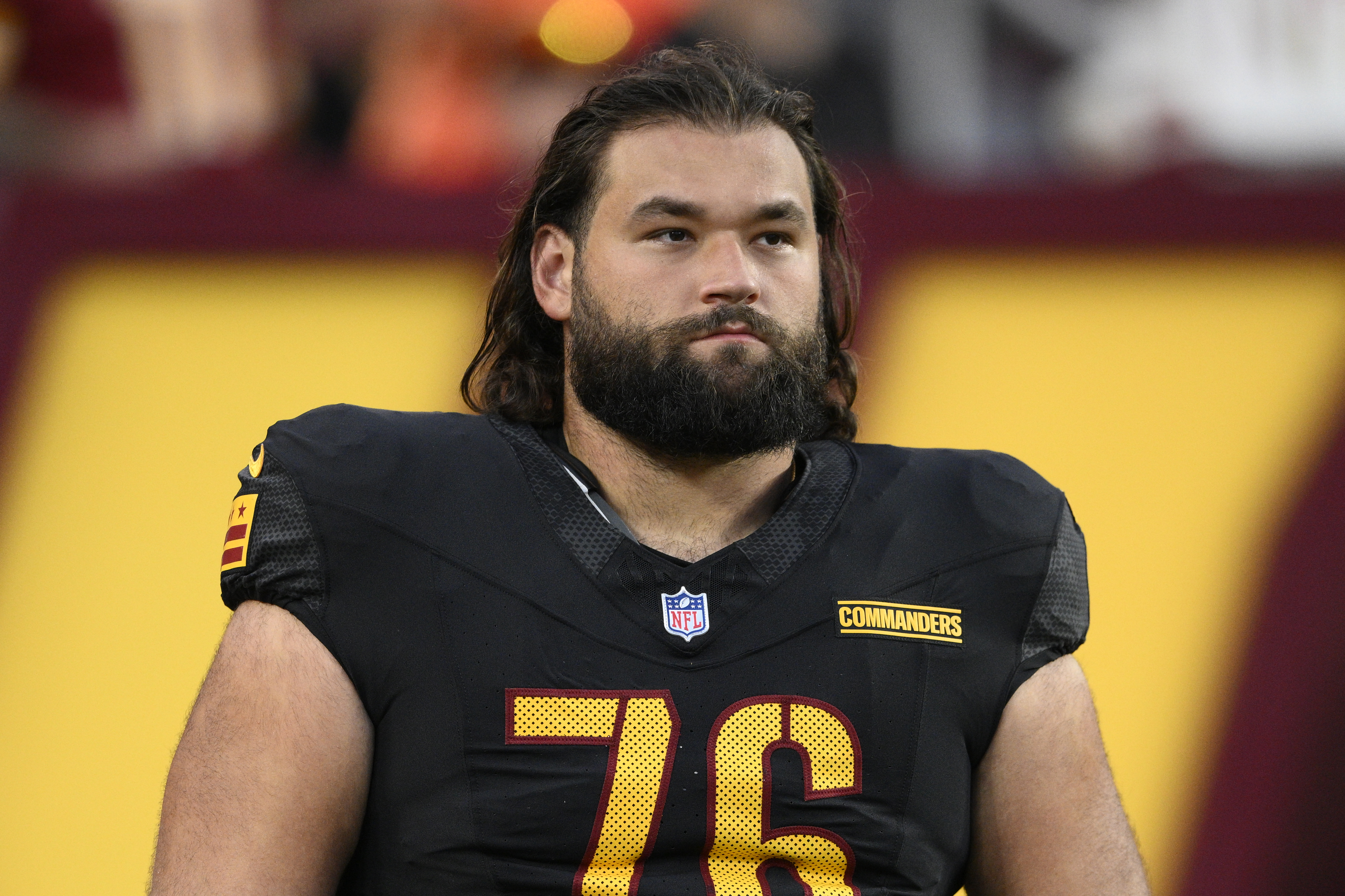 FILE - Washington Commanders guard Sam Cosmi (76) looks on before an NFL preseason football game against the New England Patriots, Aug. 25, 2024, in Landover, Md. 