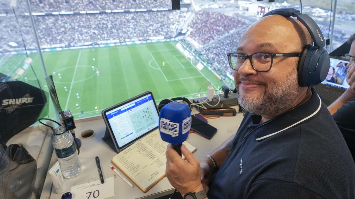 Radio sports commentator Marcelo do Ó smiles while working in press box during a Brazilian soccer league match at the NeoQuimica Arena in Sao Paulo, Brazil, Sunday, Sept. 1, 2024. Local commentators and experts in Brazil will host its first ever NFL match on Sept. 6, 2024.