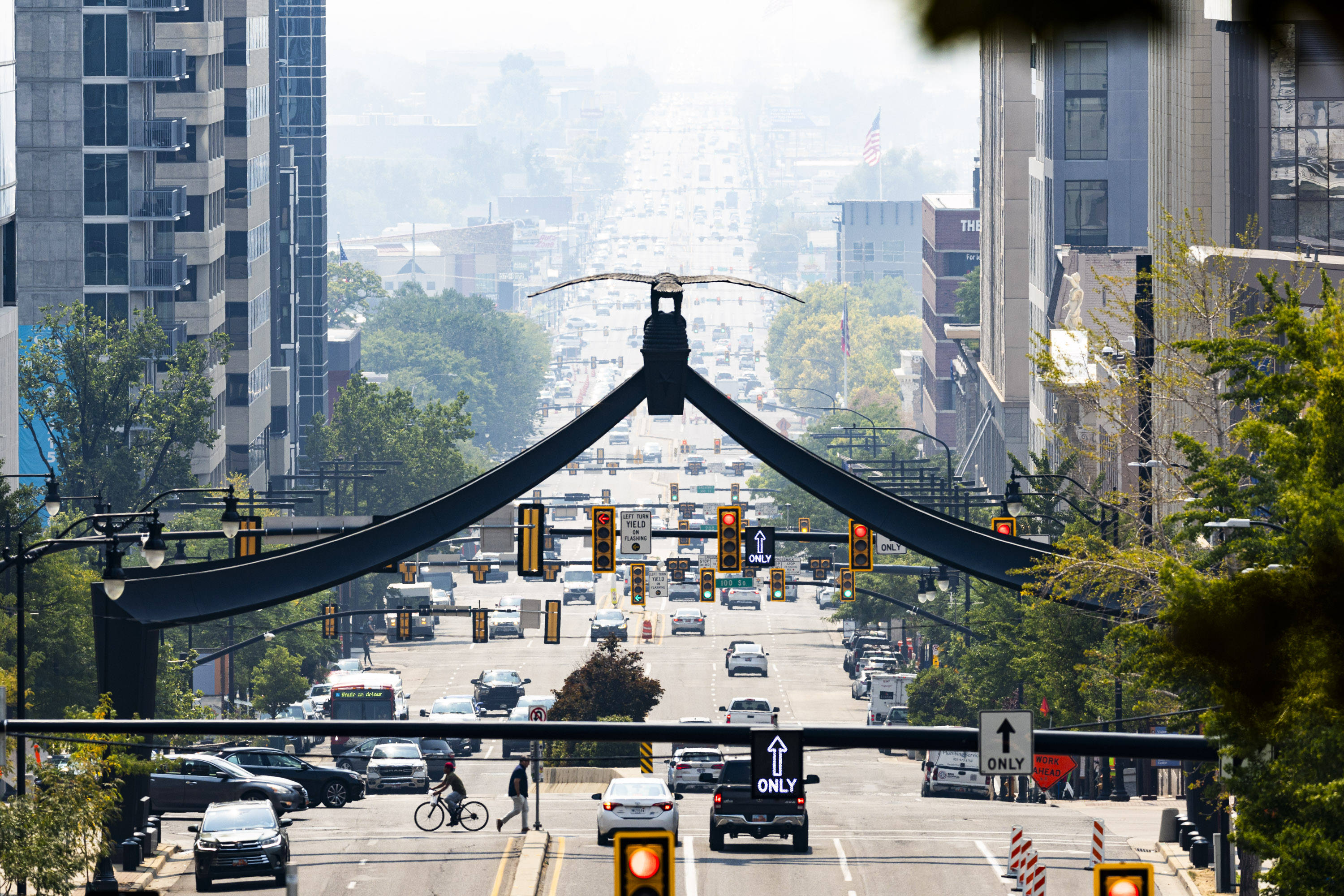 Wildfire smoke congests the air in downtown Salt Lake City, as seen from along State Street at the Eagle Gate Monument on Wednesday.
