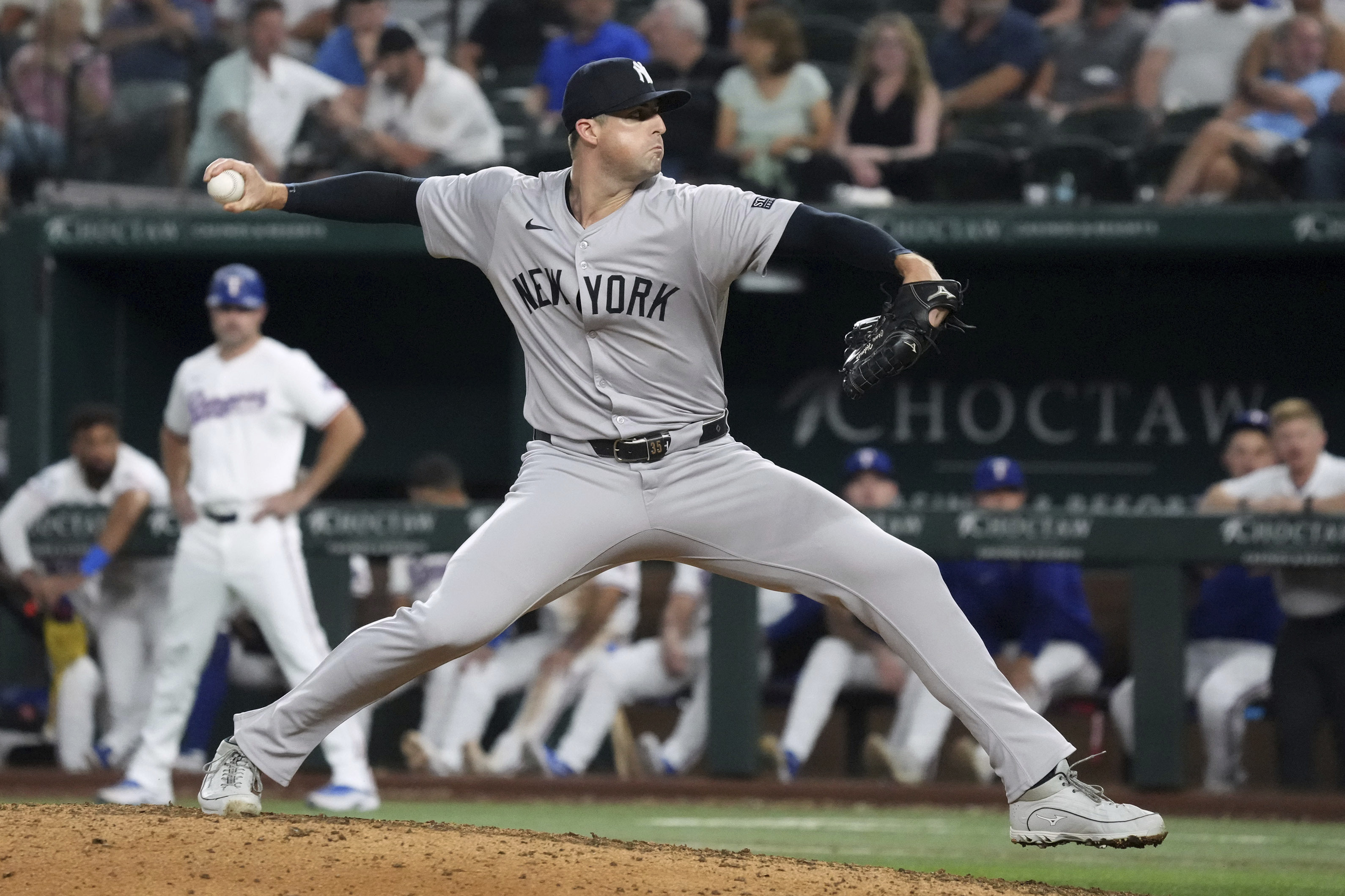 New York Yankees relief pitcher Clay Holmes pitches against the Texas Rangers during the ninth inning of a baseball game Tuesday, Sept. 3, 2024, in Arlington, Texas. 