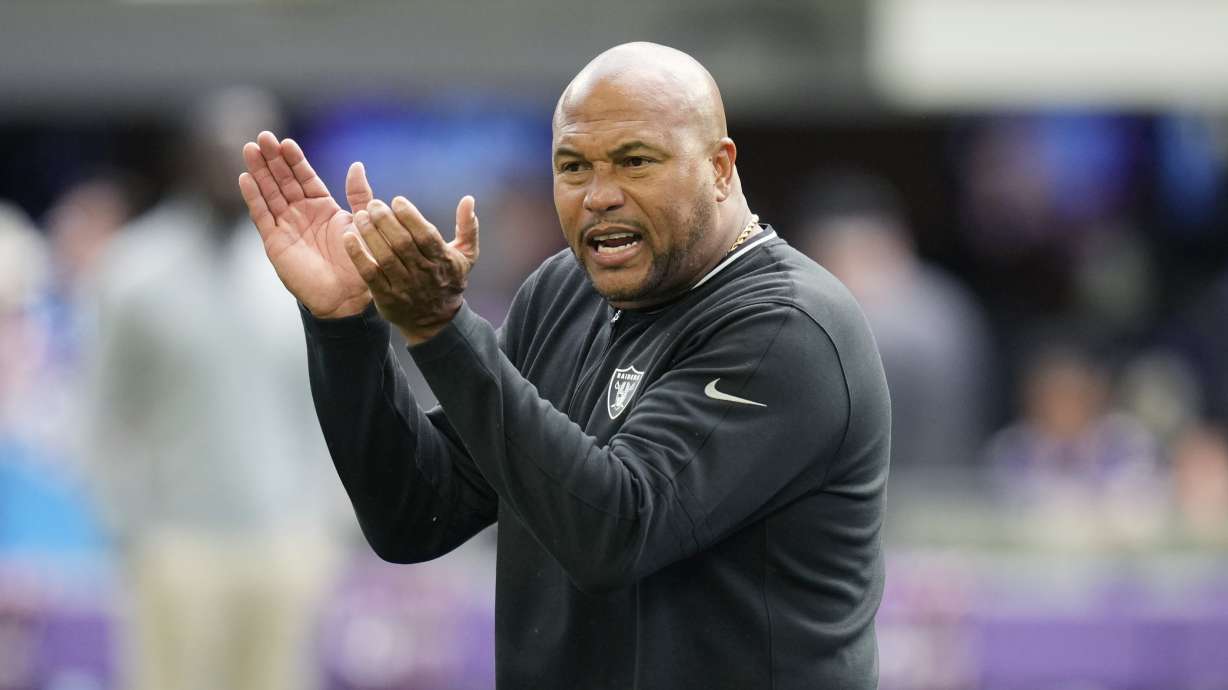 Las Vegas Raiders head coach Antonio Pierce talks to his players before an NFL preseason football game against the Minnesota Vikings, Saturday, Aug. 10, 2024, in Minneapolis.