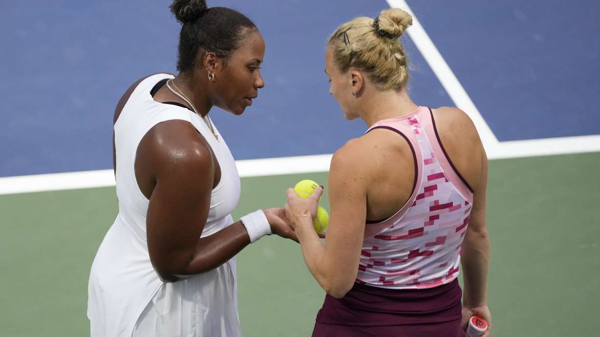Katerina Siniakova, of the Czech Republic, and Taylor Townsend, of the United States, react during a second round match of the U.S. Open tennis championships, Thursday, Aug. 29, 2024, in New York.