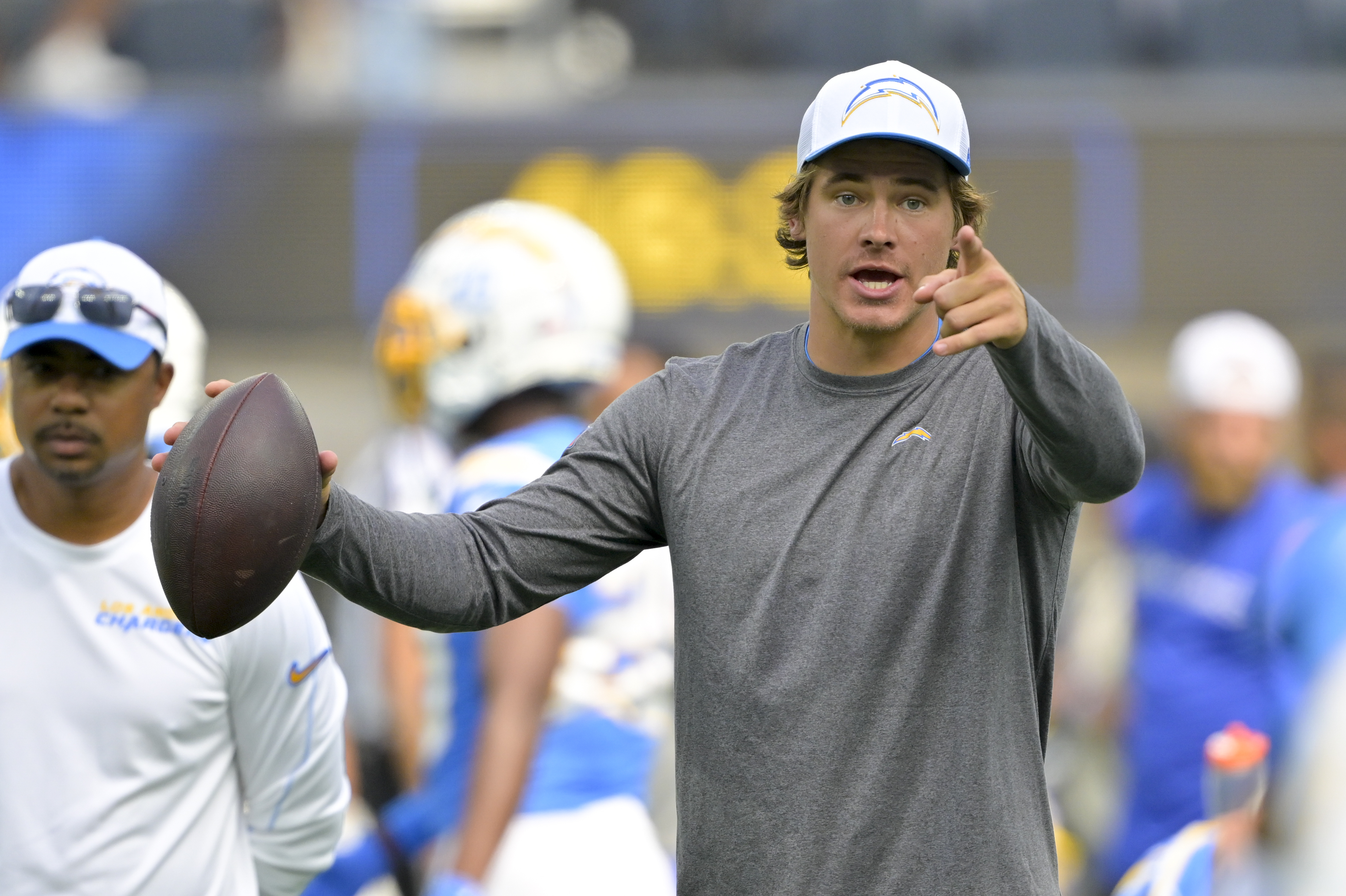 Los Angeles Chargers quarterback Justin Herbert (10) warms up before a preseason NFL football game against the Los Angeles Rams, Saturday, Aug. 17, 2024, in Inglewood, Calif. 