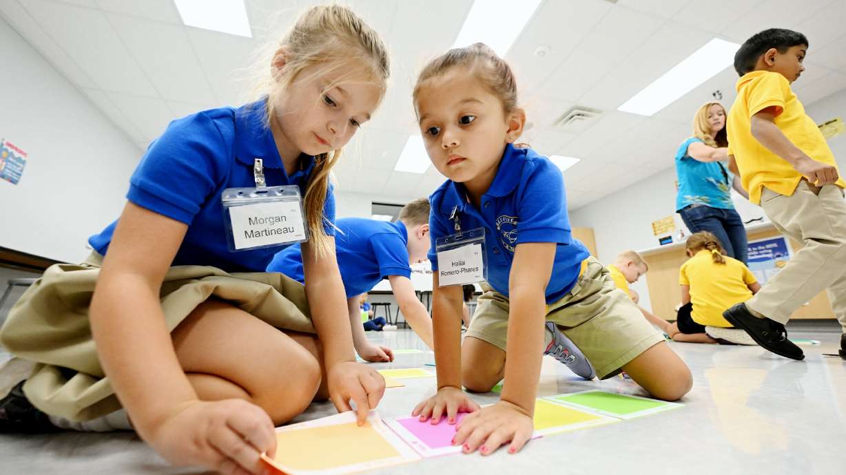 Morgan Martineau and Hailai Romero-Phares during their full-day kindergarten at Beehive Science and Technology Academy in Sandy, Aug. 16. A study found there is not a significant loss of parent time when children attend full-day kindergarten.