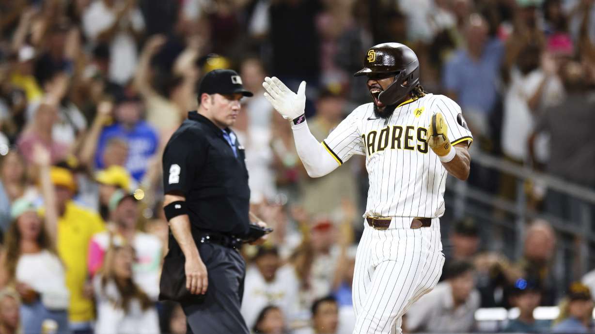 San Diego Padres' Fernando Tatis Jr. celebrates after scoring on a sight hit by Manny Machado in the fifth inning of a baseball game Wednesday, Sept. 4, 2024, in San Diego.