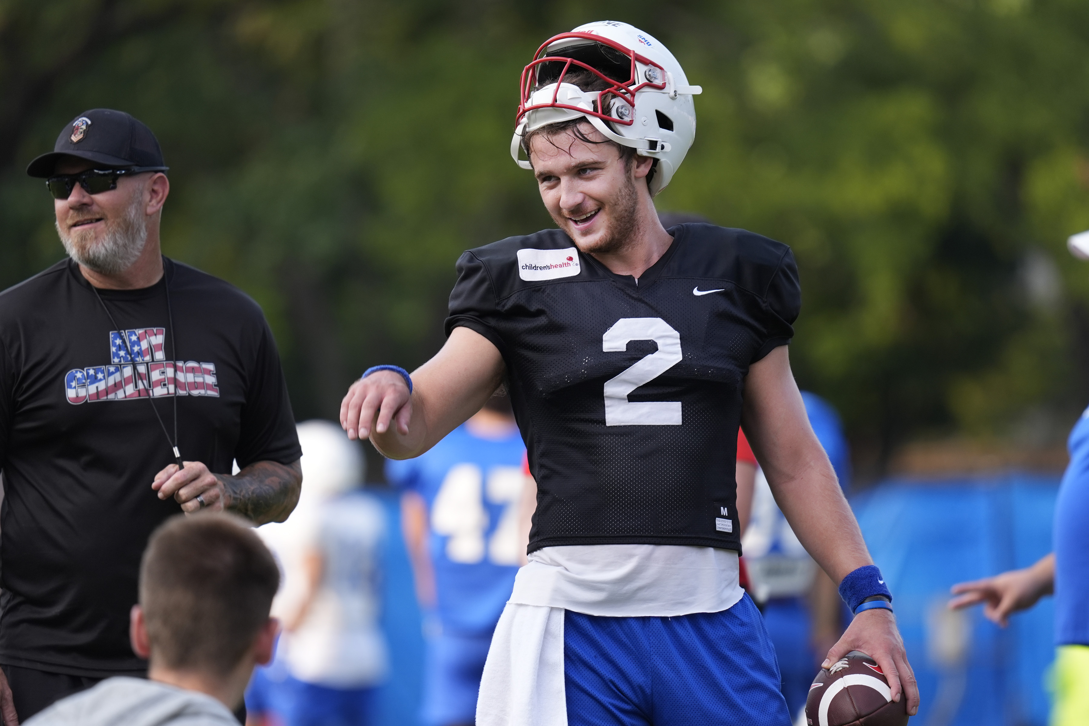 SMU quarterback Preston Stone smiles during an NCAA college football practice in Dallas, Friday, Aug. 9, 2024. 