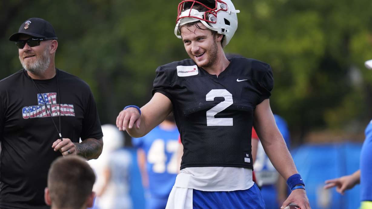 SMU quarterback Preston Stone smiles during an NCAA college football practice in Dallas, Friday, Aug. 9, 2024.