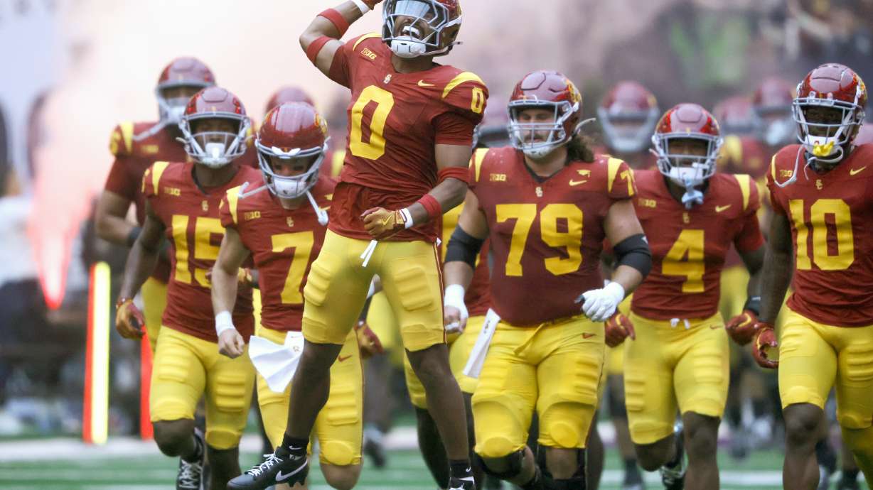Southern California players take to the field for an NCAA football game against LSU, Sunday, Sept. 1, 2024, in Las Vegas.