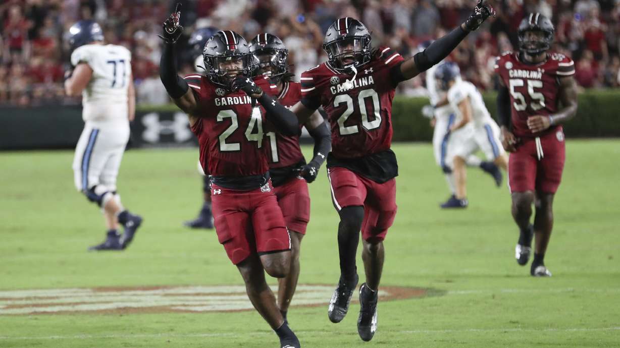 South Carolina defensive back Jalon Kilgore (24) celebrates a game clinching interception with defensive back Judge Collier (20) during the second half of an NCAA college football game against Old Dominion Saturday, Aug. 31, 2024, in Columbia, S.C.