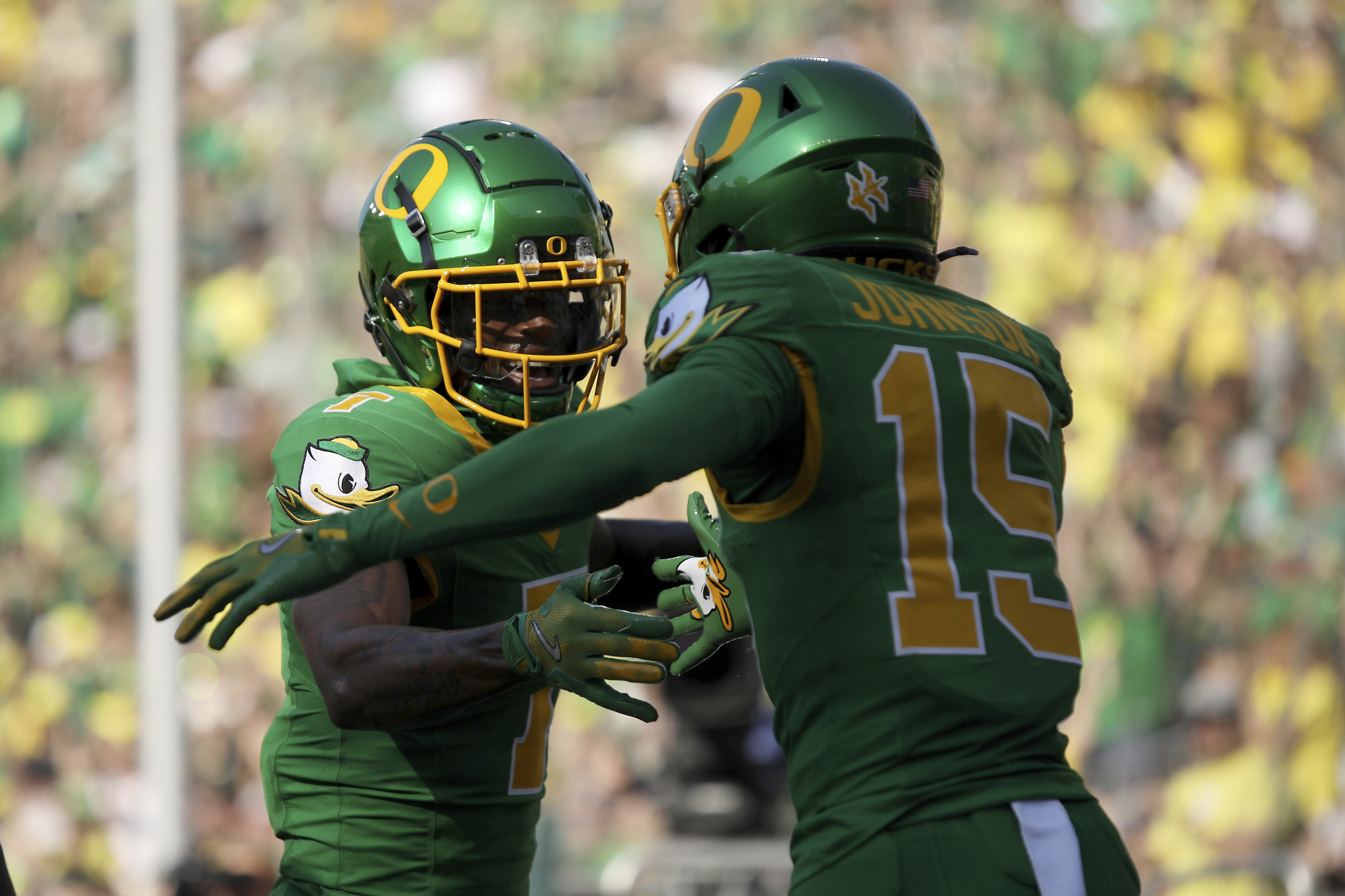 Oregon wide receivers Evan Stewart (7) and Tez Johnson (15) celebrate a play during the first half of an NCAA college football game against Idaho, Saturday, Aug. 31, 2024, in Eugene, Ore. 