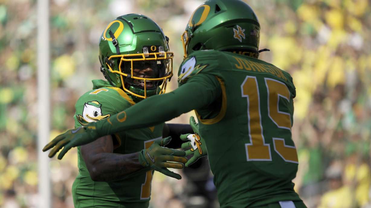 Oregon wide receivers Evan Stewart (7) and Tez Johnson (15) celebrate a play during the first half of an NCAA college football game against Idaho, Saturday, Aug. 31, 2024, in Eugene, Ore.