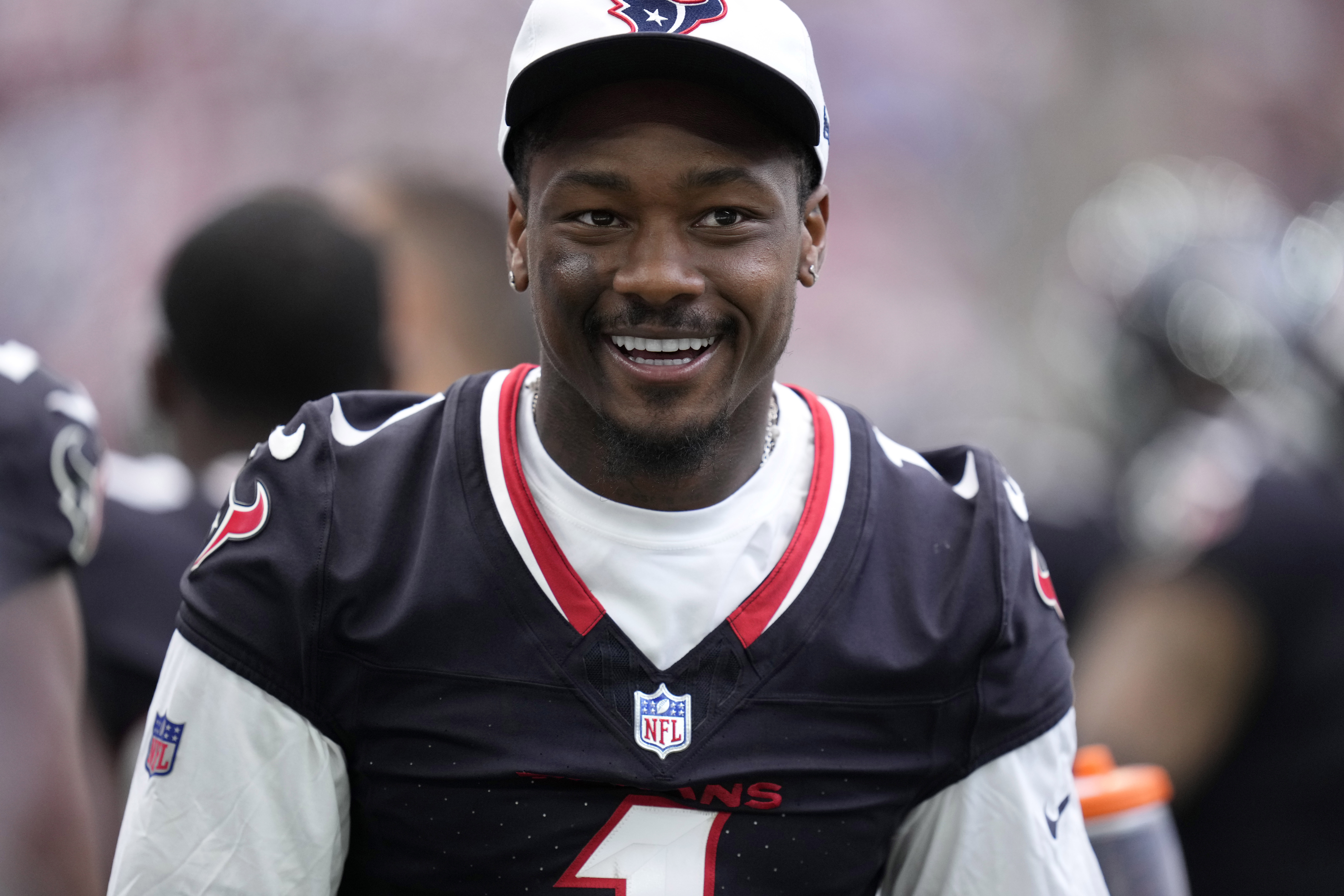 Houston Texans wide receiver Stefon Diggs walks along the sideline watchig play against the New York Giants in the second half of a preseason NFL football game, Saturday, Aug. 17, 2024, in Houston. 