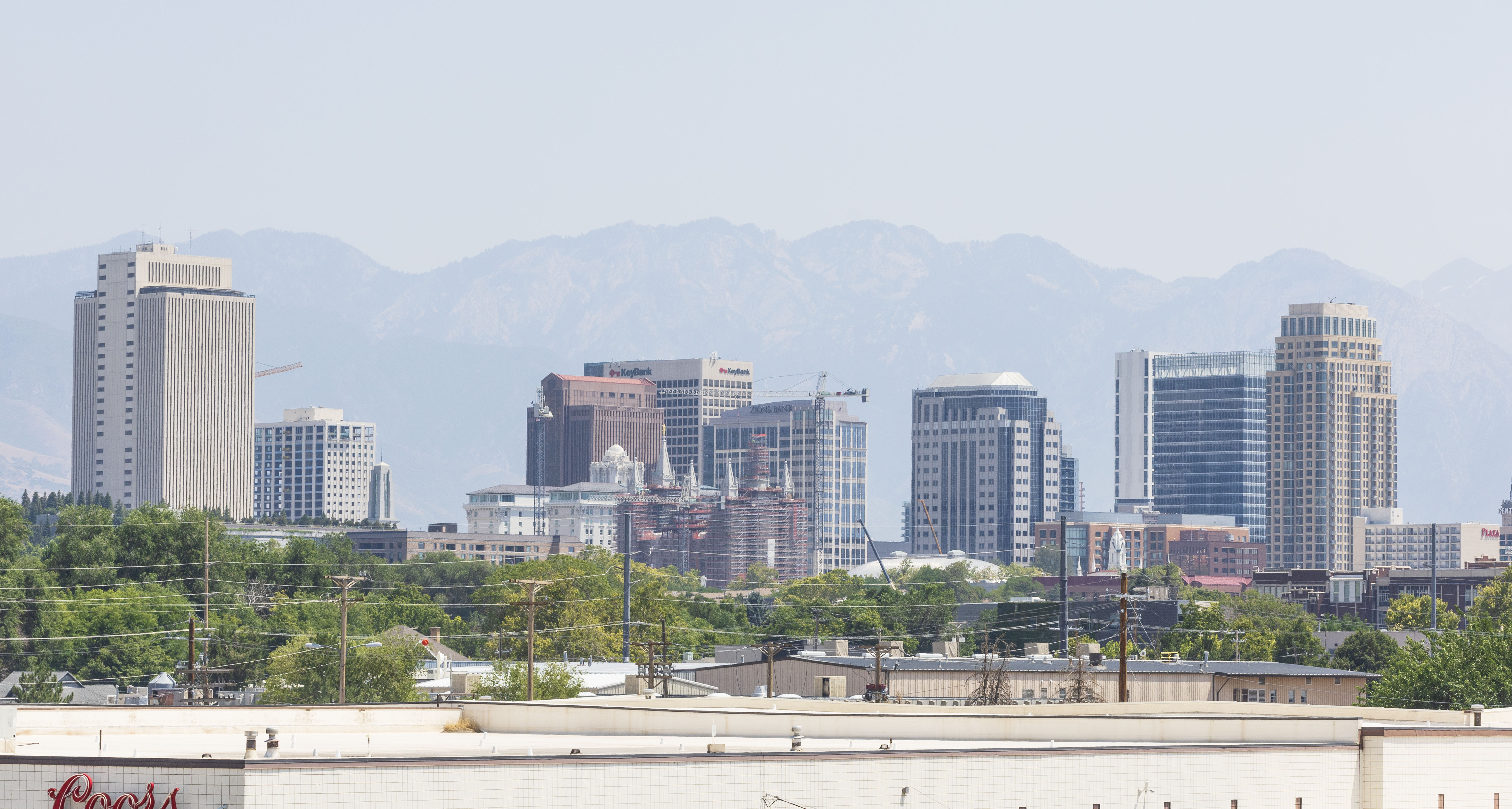 Haze hangs over the skyline of downtown Salt Lake City on Aug. 2. In its latest report, the Utah Foundation asked Utahns what they believed were the state's most significant issues. Housing, adolescent education and water usage turned out to be predominantly bipartisan issues.