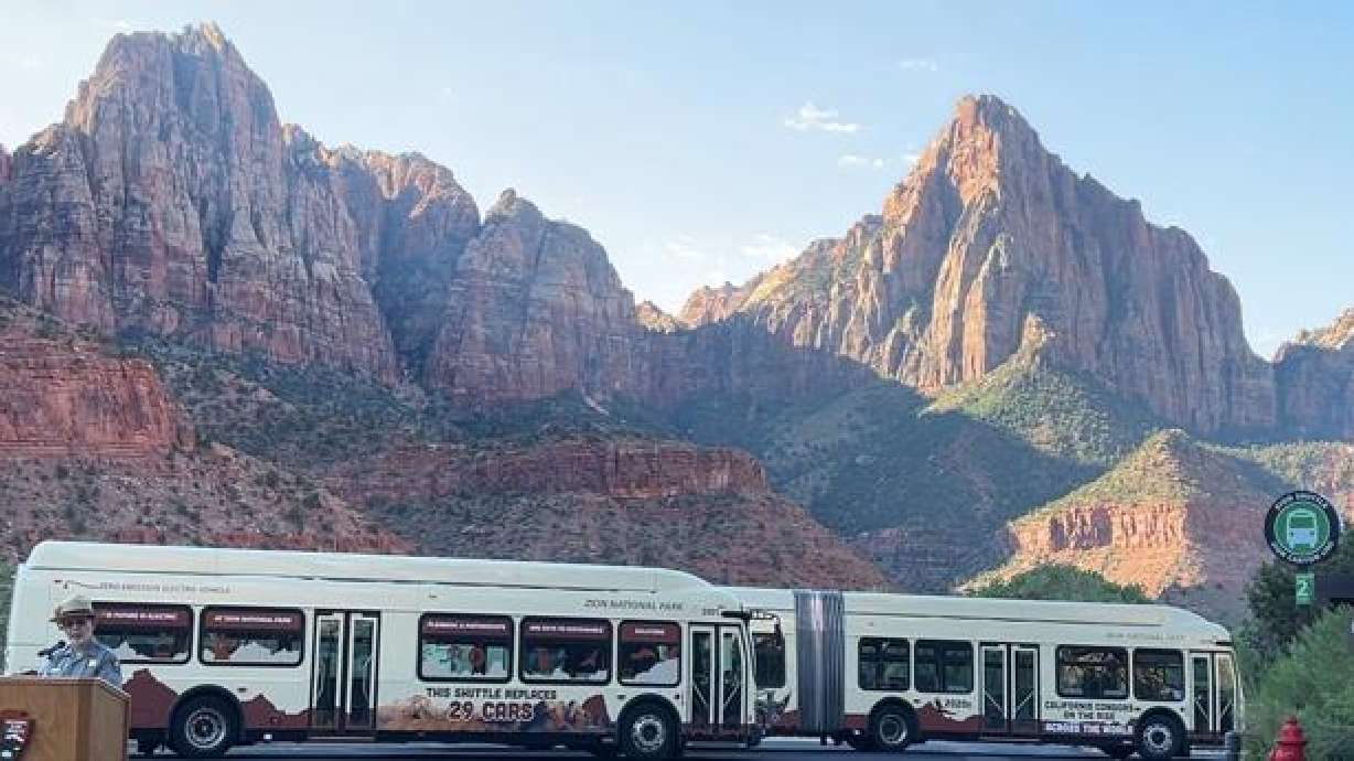 Jeff Bradybaugh, Zion National Park superintendent of Zion National Park, talks to the crowd celebrating the country's first electric shuttle bus fleet in a national park Wednesday morning, Springdale, Wednesday.