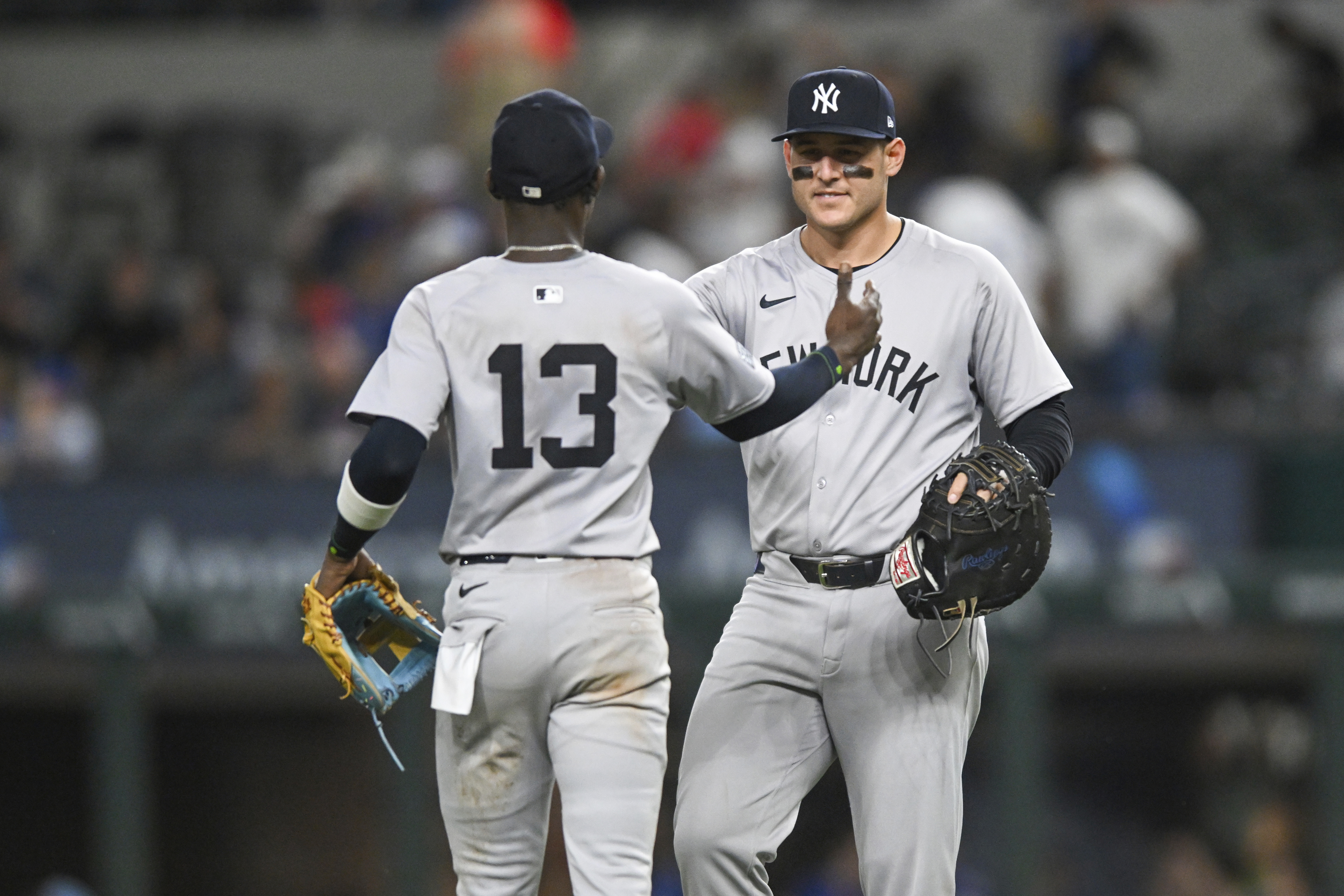New York Yankees Anthony Rizzo, right, and teammate Jazz Chisholm Jr., left, celebrate after a baseball game against the Texas Rangers, Monday, Sept. 2, 2024, in Arlington, Texas. 