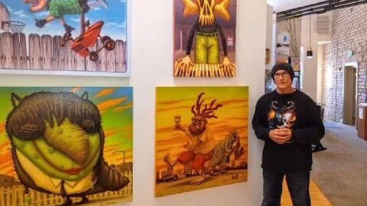 Reece Thompson stands next to his art on display at ART Provides in St. George in this undated image. The Southern Utah artist hopes to defy the traditional norms about art and captivate the imagination.