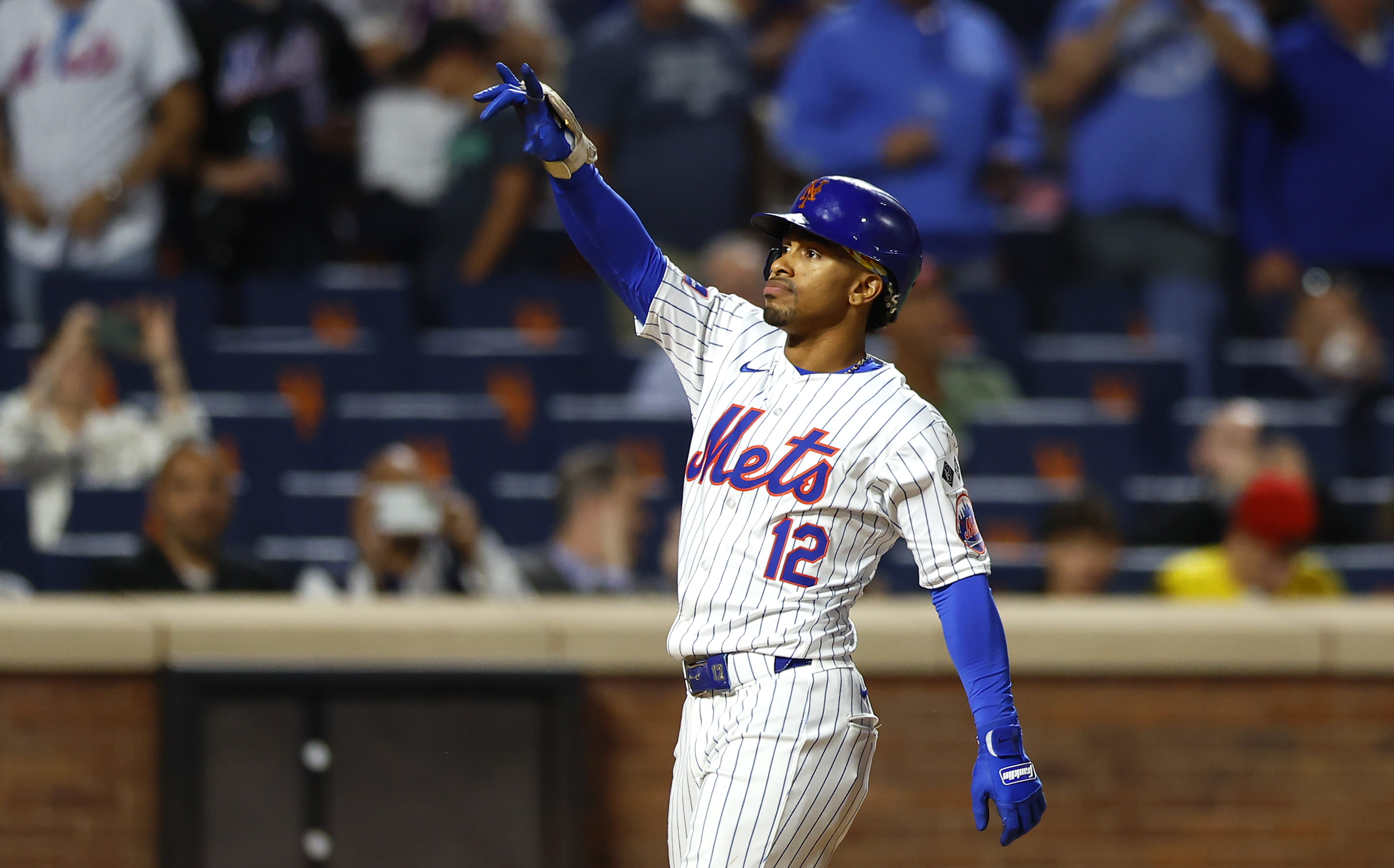 New York Mets' Francisco Lindor reacts after hitting a two run home run against the Boston Red Sox during the third inning of a baseball game, Tuesday, Sept. 3, 2024, in New York.