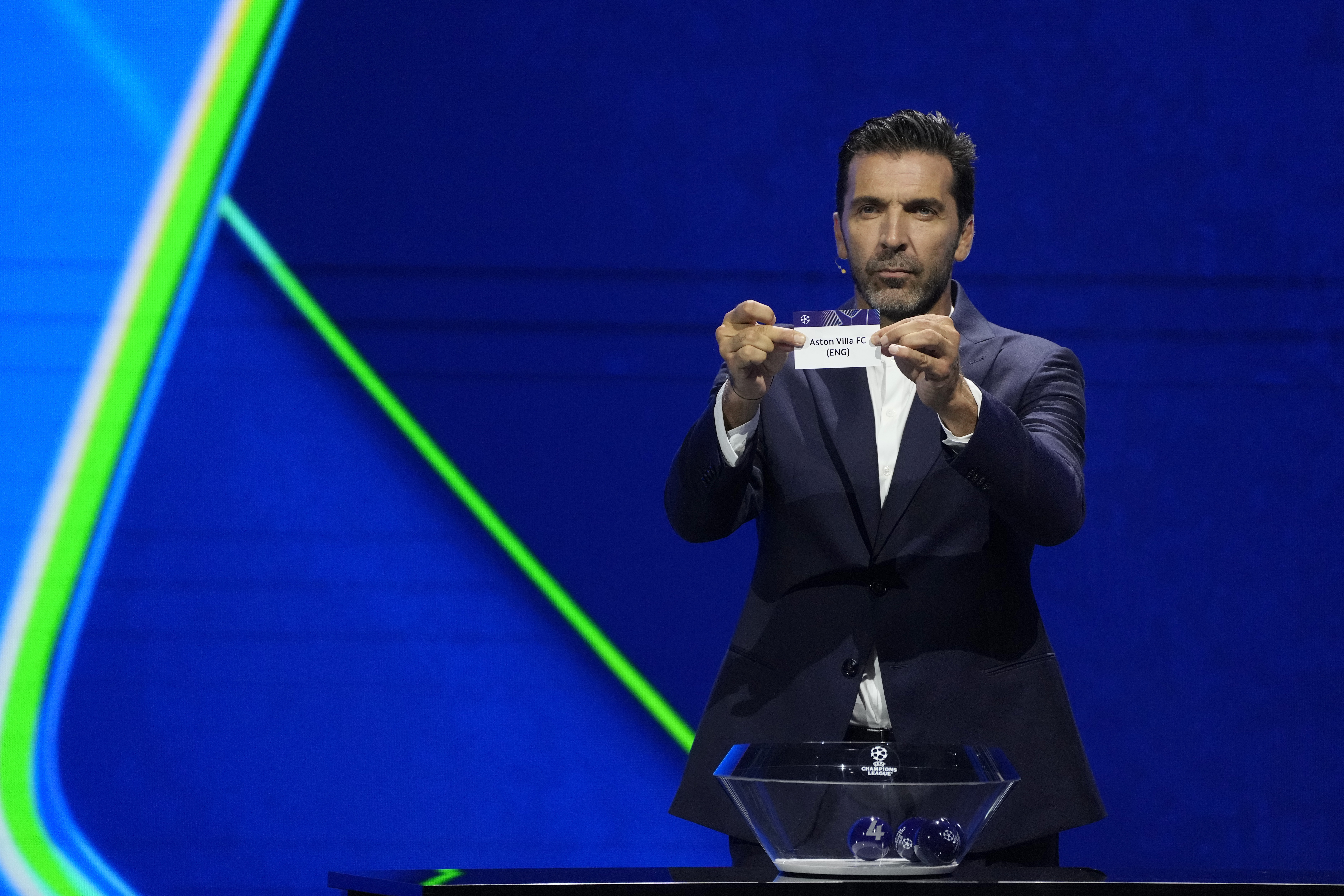 Former Italian goalkeeper Gianluigi Buffon holds a ticket for Aston Villa FC during the Champions League, league phase, draw, in Monaco, Thursday, Aug. 29, 2024.