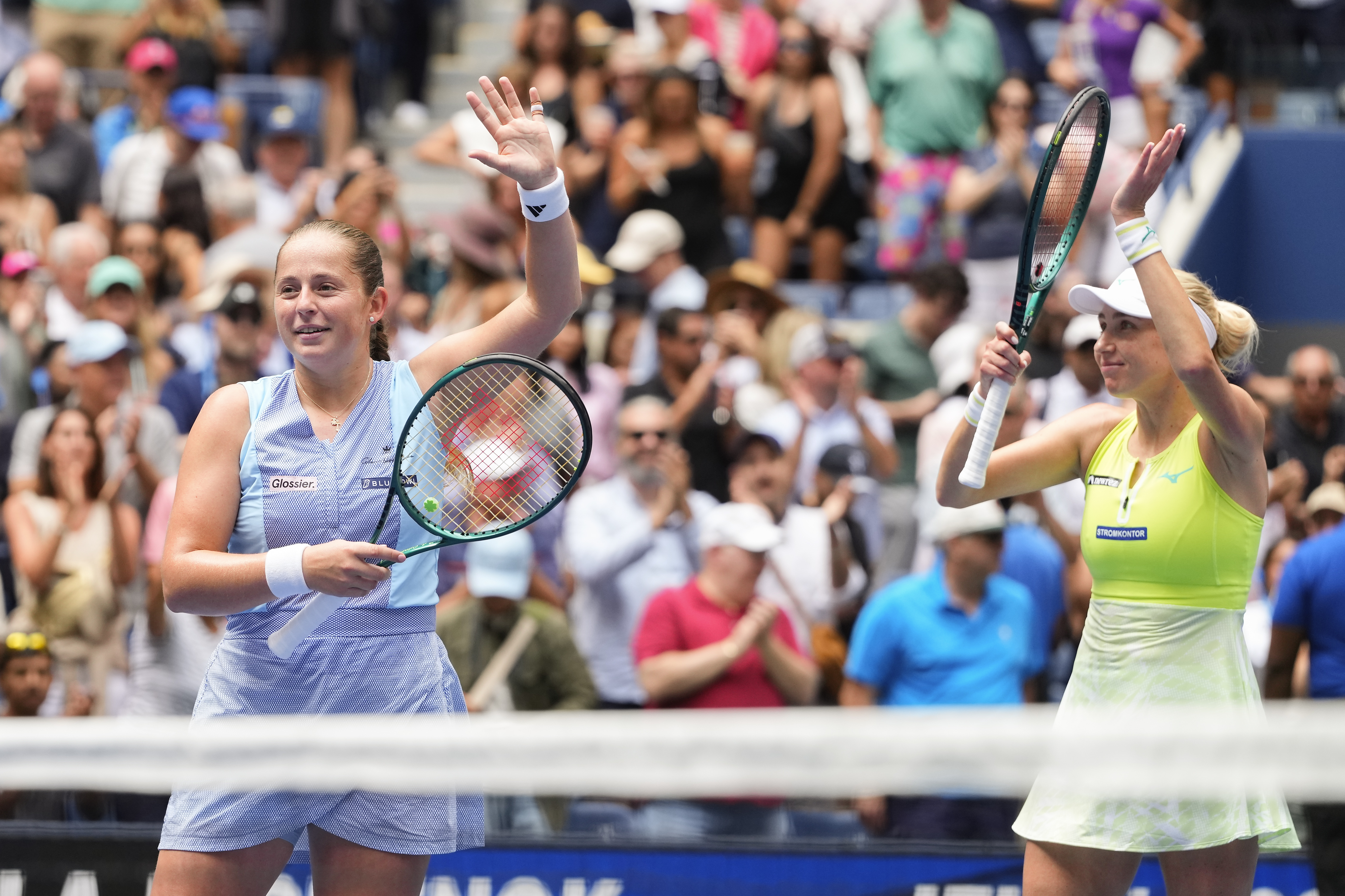 Jelena Ostapenko, of Latvia, left, and Lyudmyla KIchenok, of Ukraine, wave to the crowd after defeating Kristina Mladenovic, of France, and Zhang Shuai, of China, in the women's doubles final of the U.S. Open tennis championships, Friday, Sept. 6, 2024, in New York.