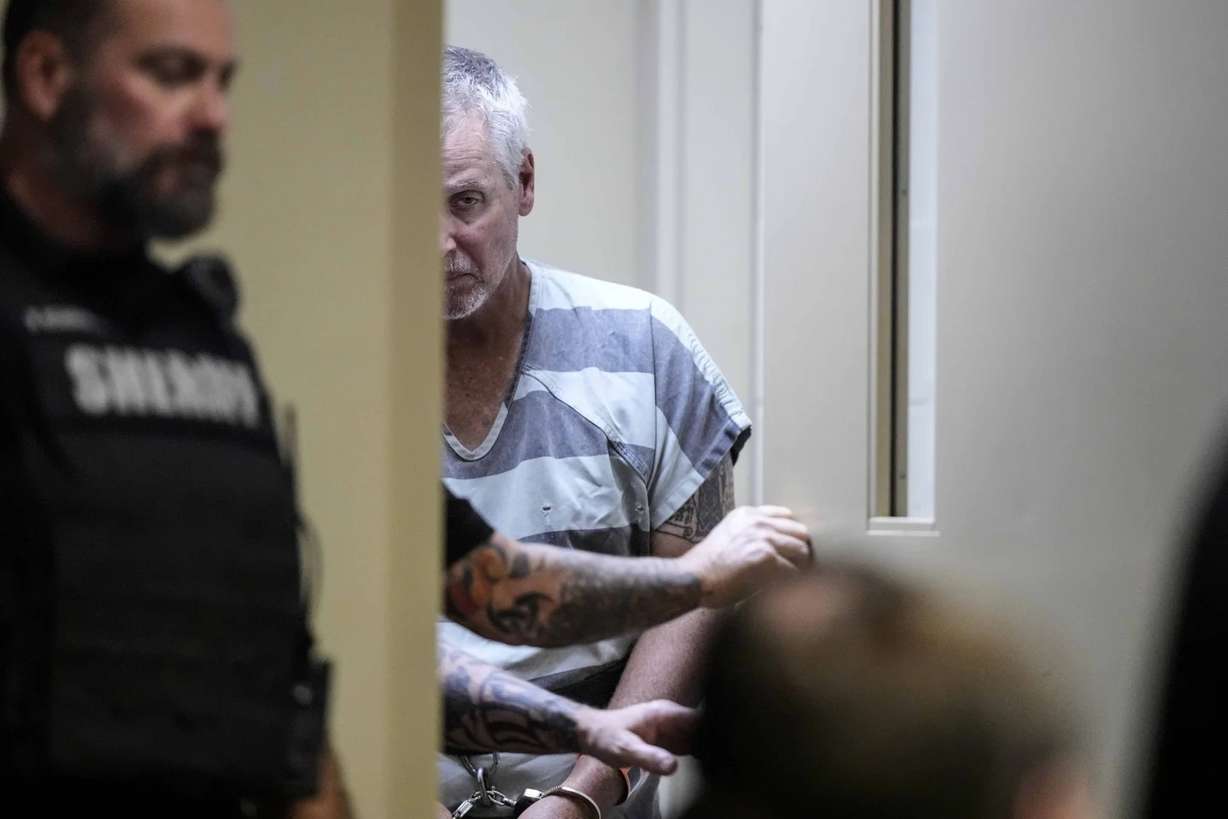 Colin Gray, 53 departs the Barrow County courthouse on Friday in Winder, Ga. Gray faces charges in a school shooting where his son Colt Gray is a suspect.