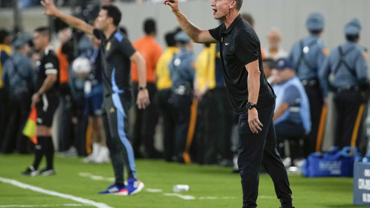 FILE - Canada's coach Jesse Marsch instructs his players during a Copa America semifinal soccer match against Argentina in East Rutherford, N.J., July 9, 2024.